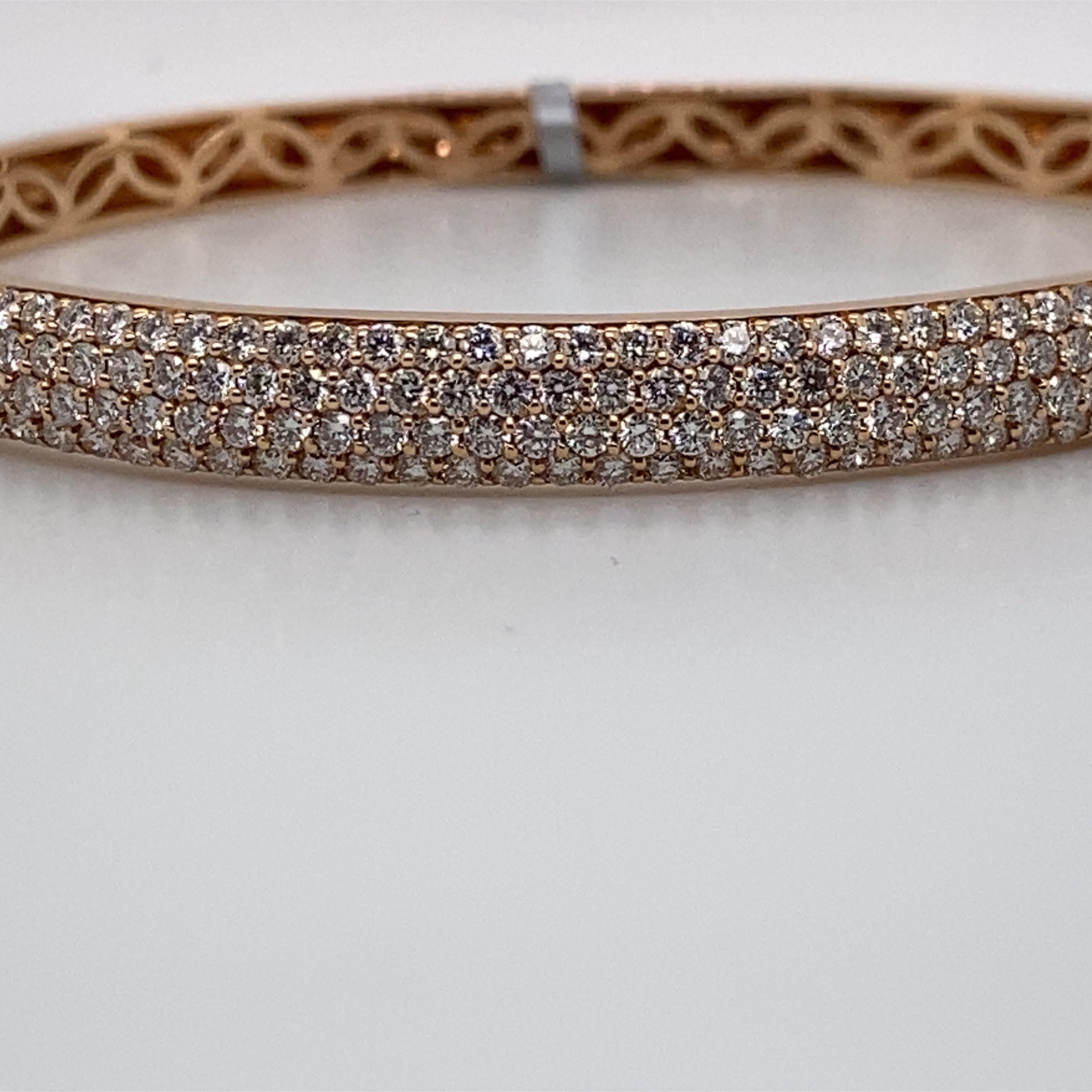 18K Rose gold bangle bracelet featuring  three rows of 172 round brilliants weighing 2.32 carats.
Color G-H
Clarity SI 

Great for stacking!
Available in yellow & white gold. 