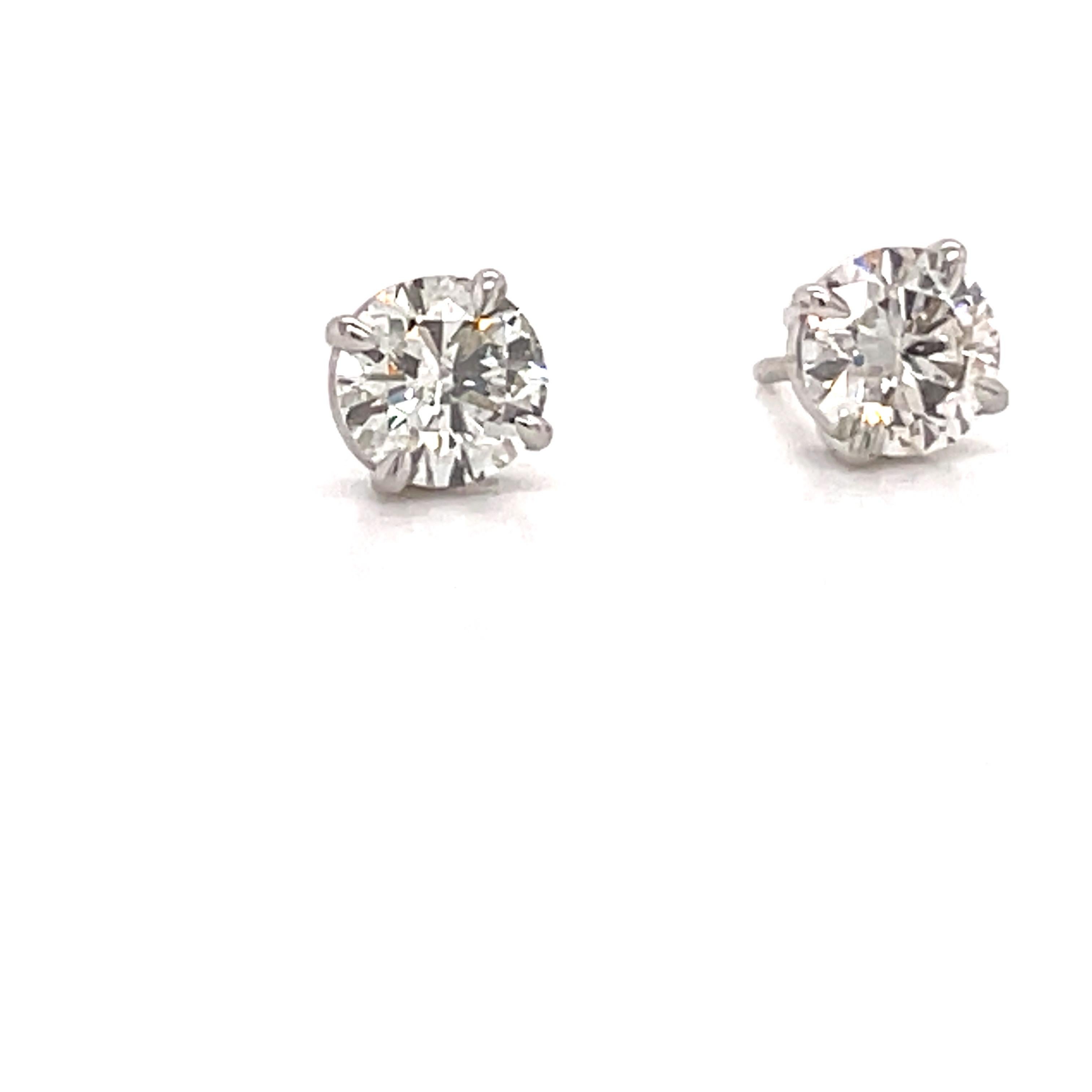 Diamond stud earrings weighing 1.83 carats in a 4 prong classic setting, crafted in 14k white gold. 
Color J-K
Clarity SI2-SI3

Email for more inventory. 