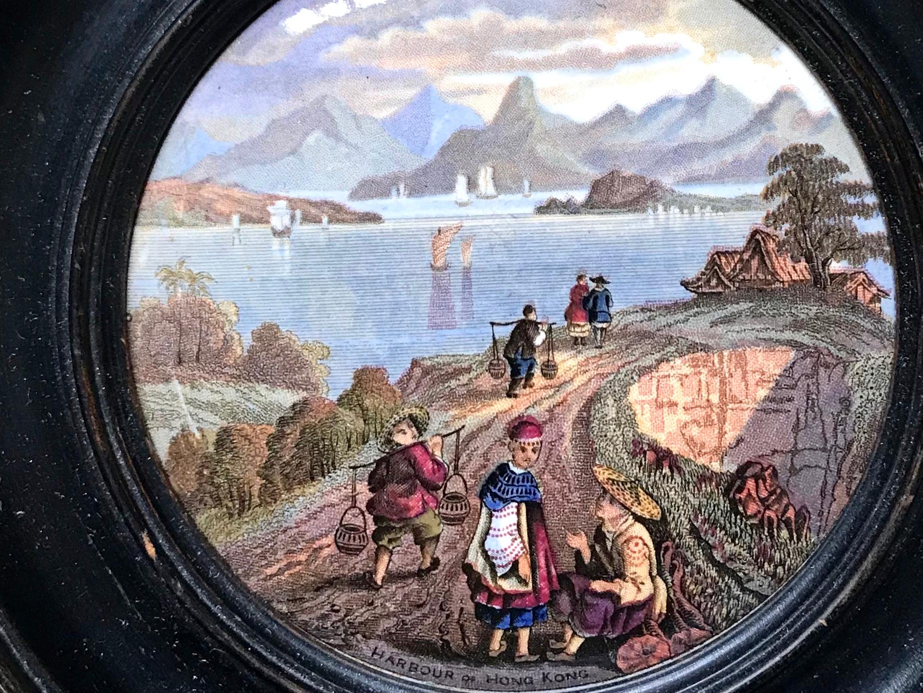 Harborview of Hong Kong Prattware decorative lid. Prattware decorative lid from turn of the century in original ebonized frame with harbor view of Hong Kong in perfect condition, England, 19th century.
Dimensions including frame: 6.13 diameter x