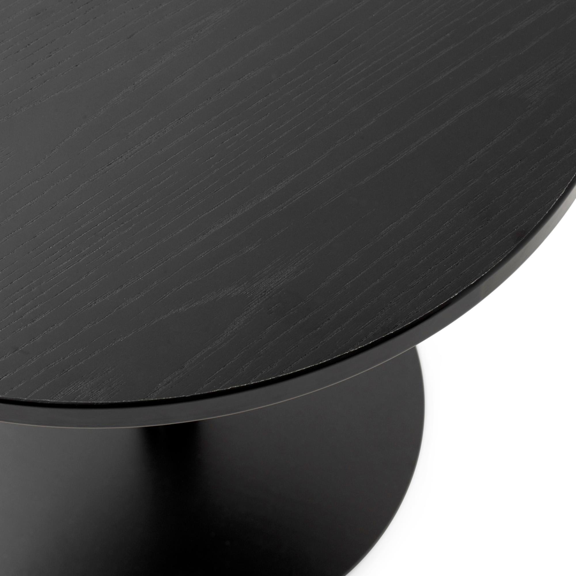 The Harbour column table is available with three tabletop sizes: two round and one rectangular. Each can be crafted in charcoal linoleum, black oak veneer, or off-white marble to suit your space and design preferences.

The clover-shaped column