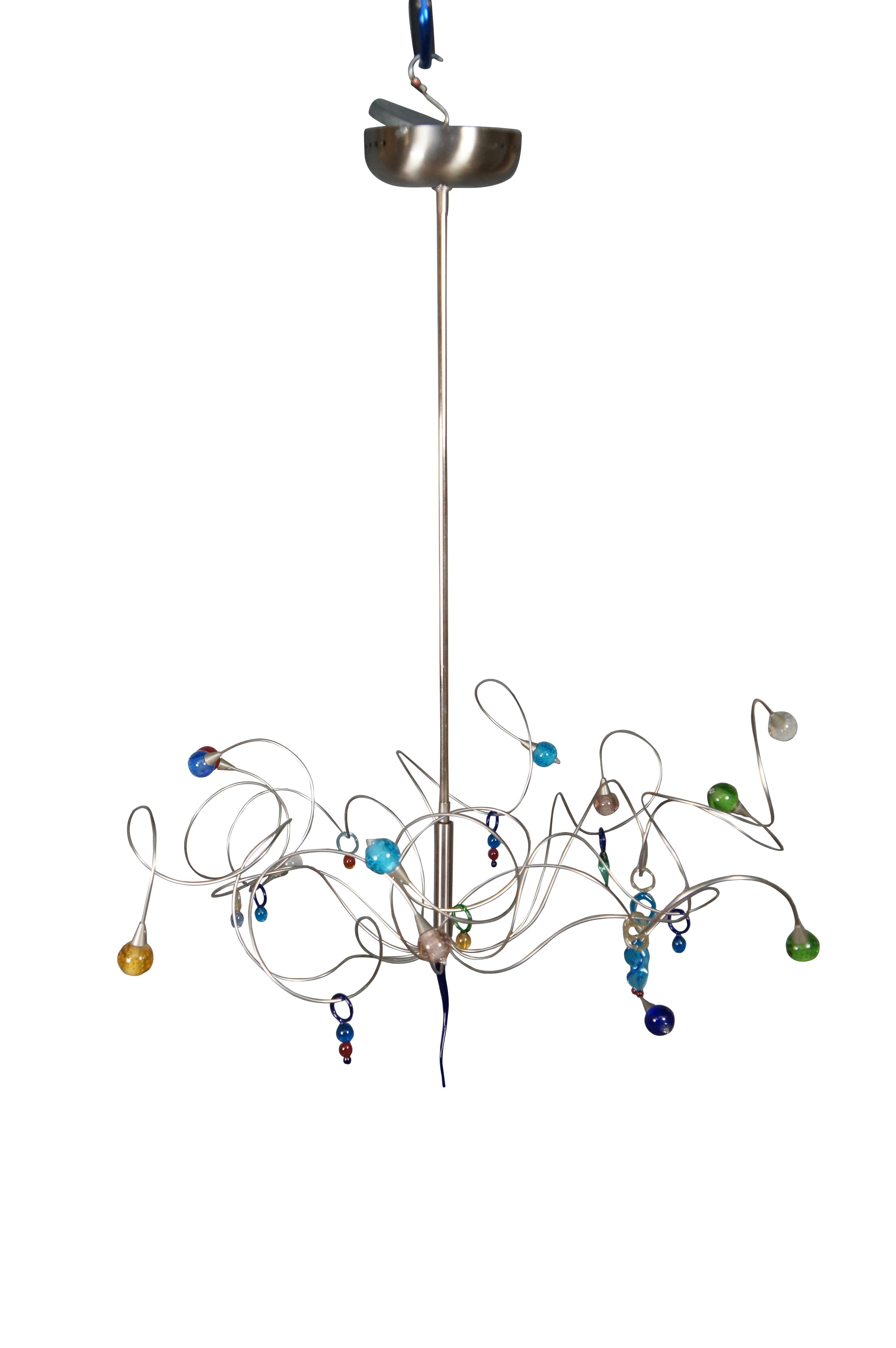 Strawberry suspension features stainless steel bendable arms with glass shades and trinkets in multicolor.  Features Murano glass art trinkets.  

Dimensions:
32