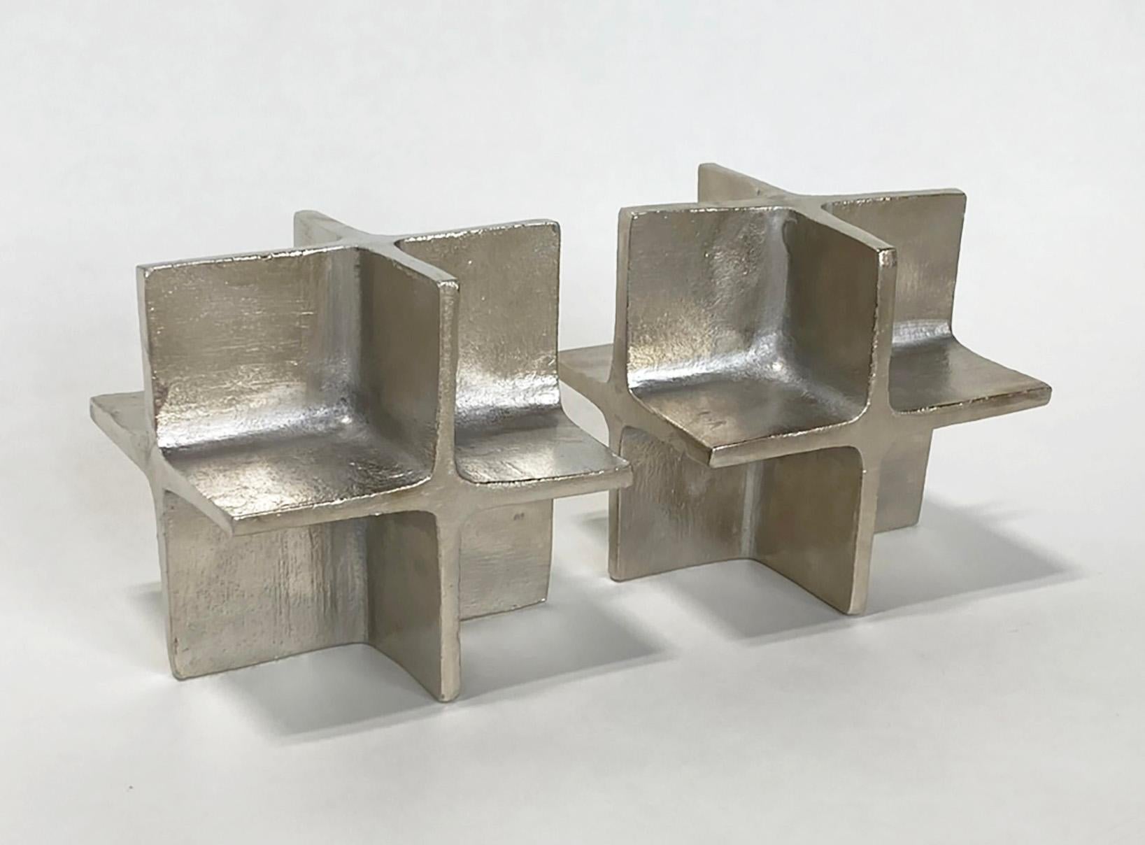 Here is a rare pair of nickel-plated iron bookends designed by Carl Auböck III and crafted by Werkstätte Carl Auböck. These bookends were part of  a brutalist-influenced collection of nickel-plated iron objects designed and produced from 1968 to the