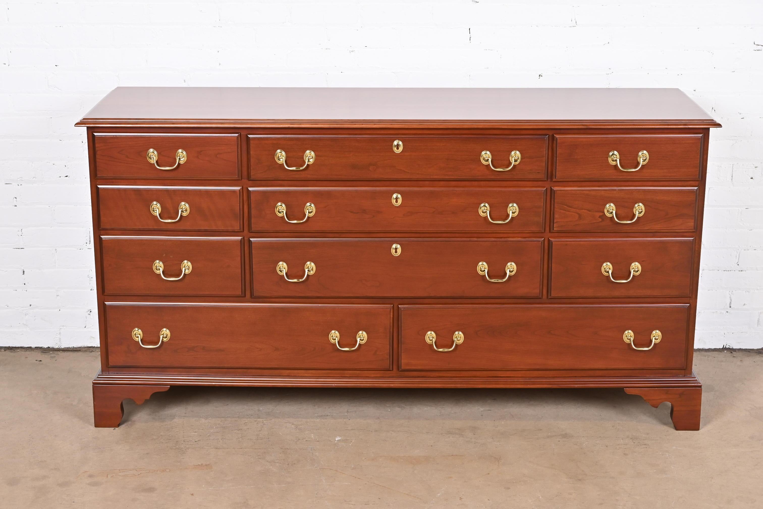An exceptional Georgian or Chippendale style eleven-drawer long dresser or credenza

By Harden Furniture

USA, Late 20th Century

Solid cherry wood, with original brass hardware.

Measures: 66