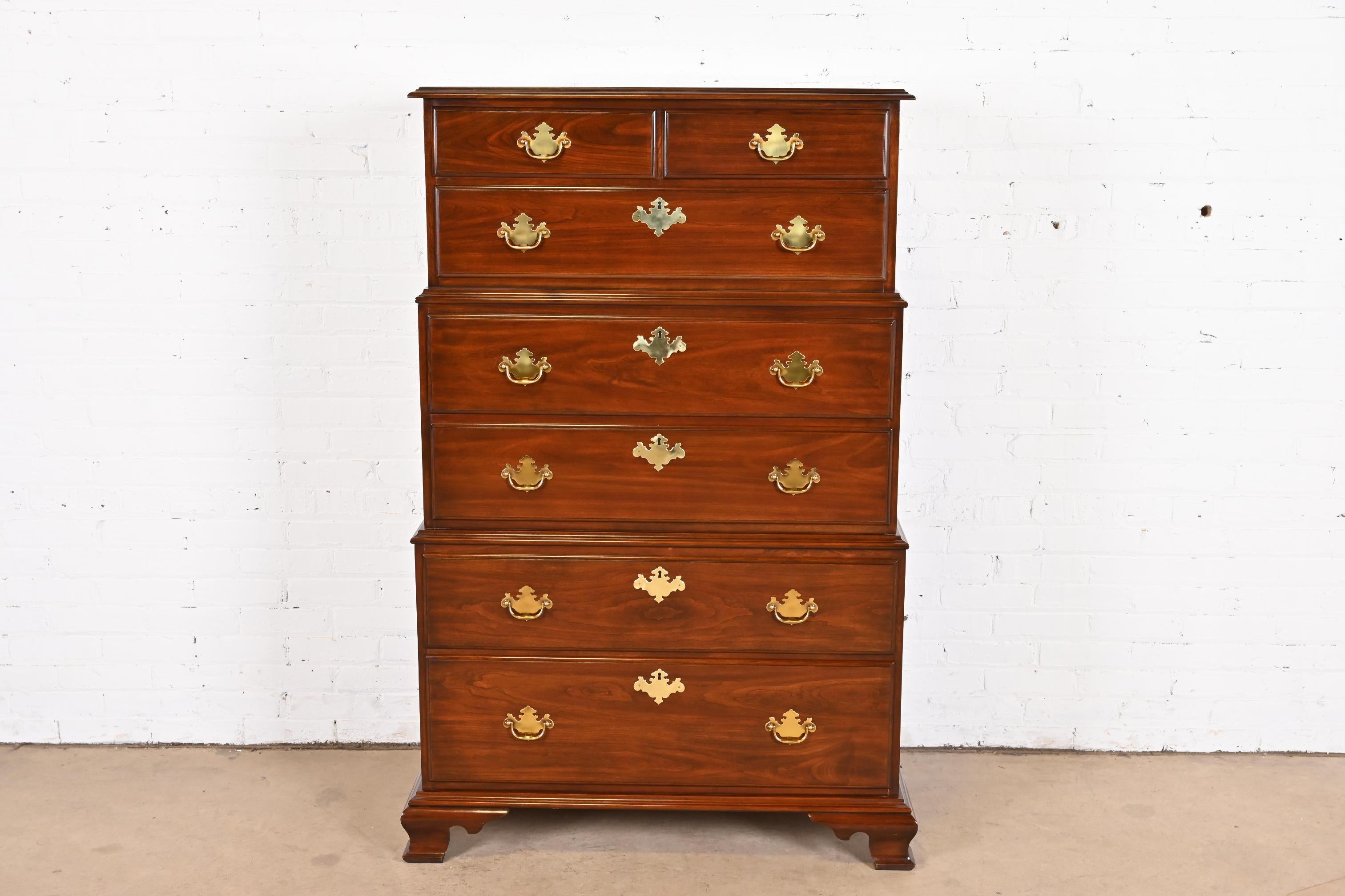 An exceptional Georgian or Chippendale style triple chest-on-chest seven-drawer highboy dresser

By Harden Furniture

USA, Late 20th century

Solid cherry wood, with original brass hardware.

Measures: 39.25
