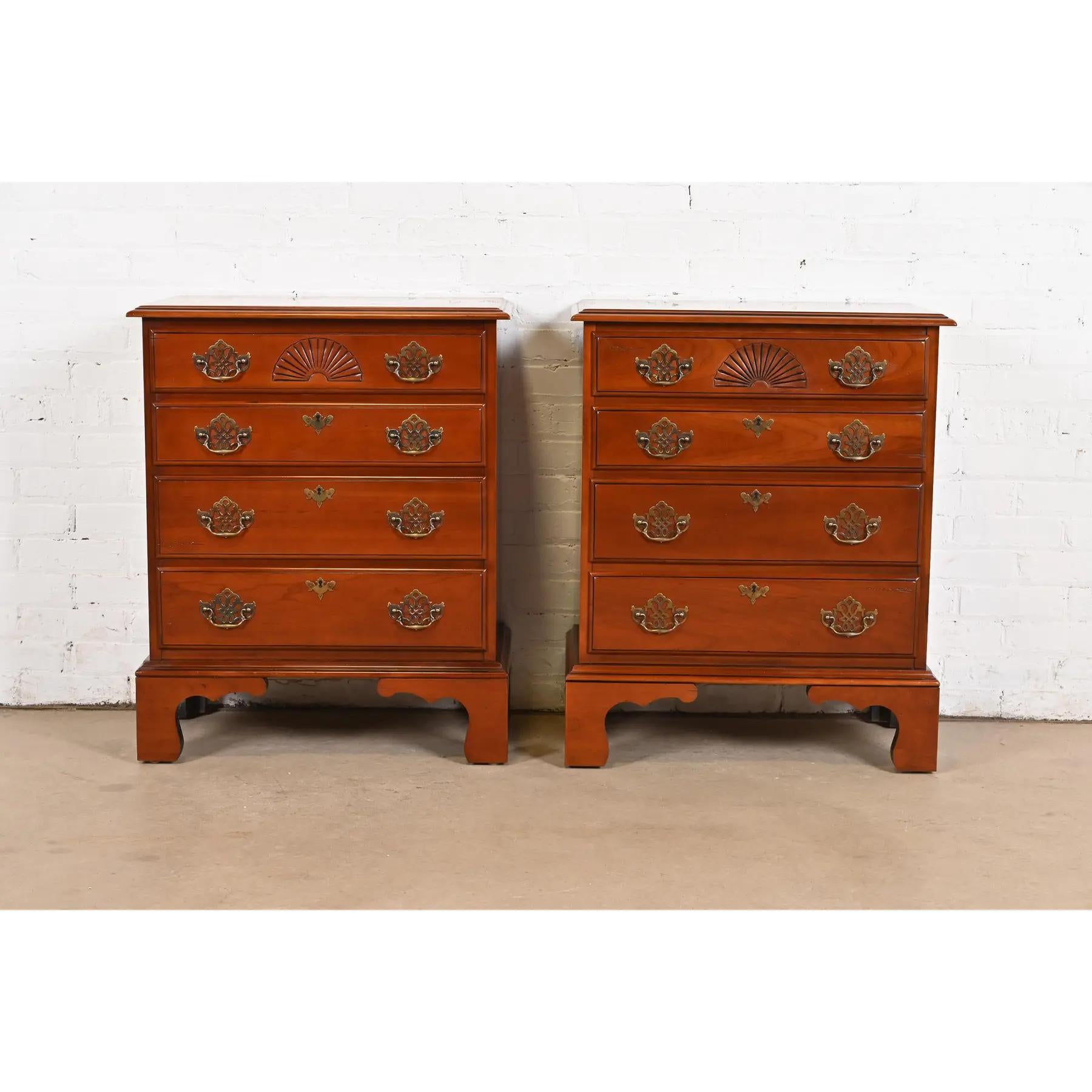 An exceptional pair of Georgian or Chippendale style four-drawer nightstands or bachelor chests

By Harden Furniture

USA, Late 20th Century

Solid carved cherry wood, with original brass hardware.

Each measures: 26