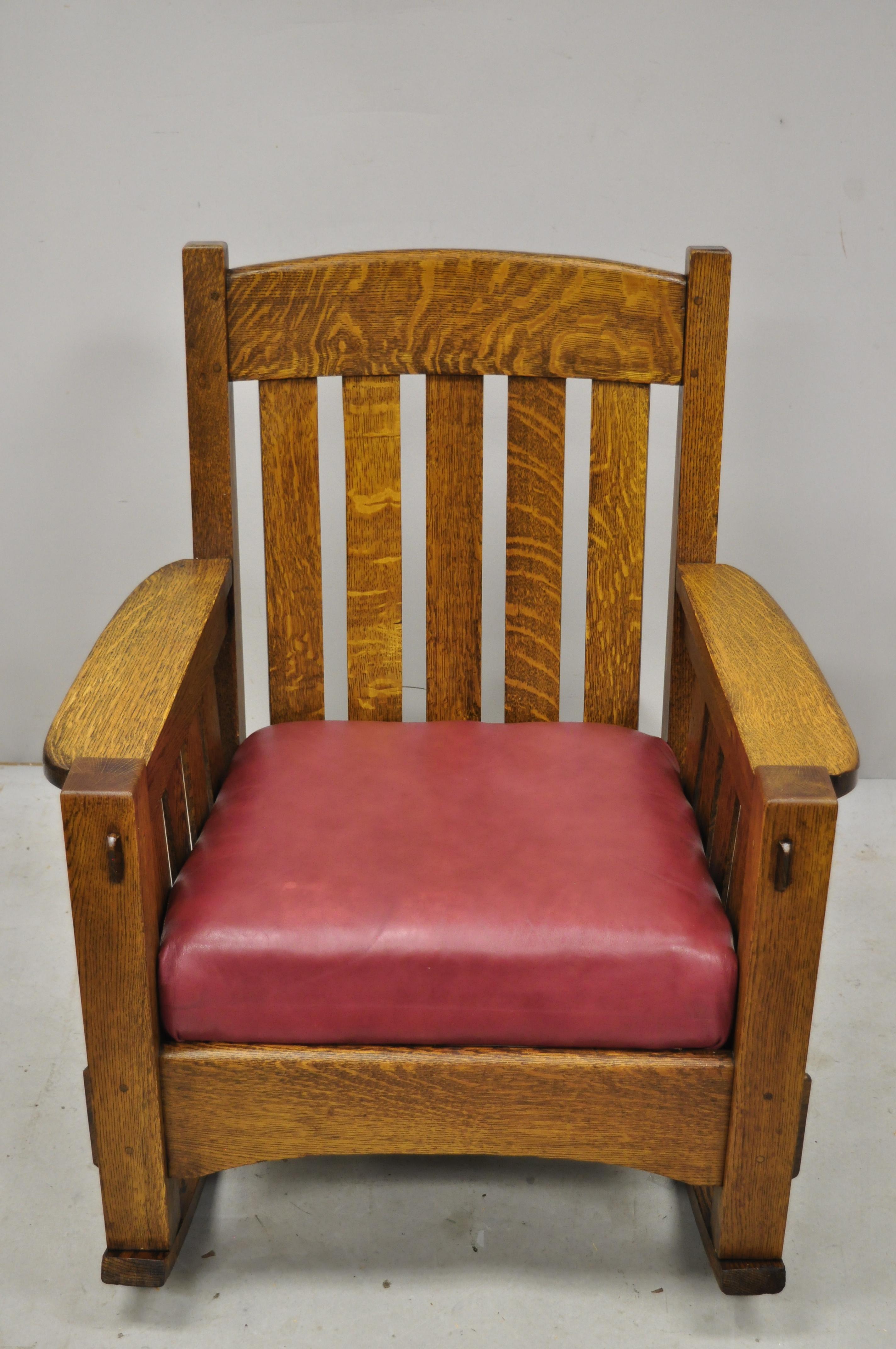 Antique Harden Mission oak Arts & Crafts rocking chair armchair in the Gustav Stickley style. Item features a solid wood frame, beautiful wood grain, leather seat, very nice antique item, quality American craftsmanship. Unmarked, but believed to be