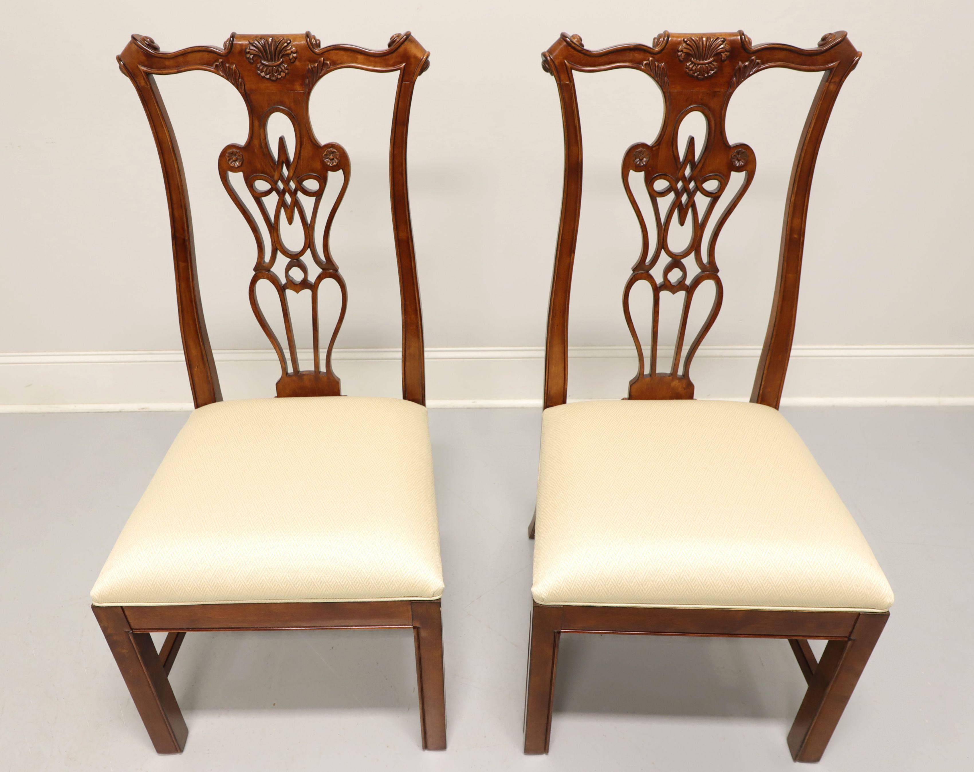 A pair of Chippendale style dining side chairs by Harden Furniture. Solid cherry wood with 