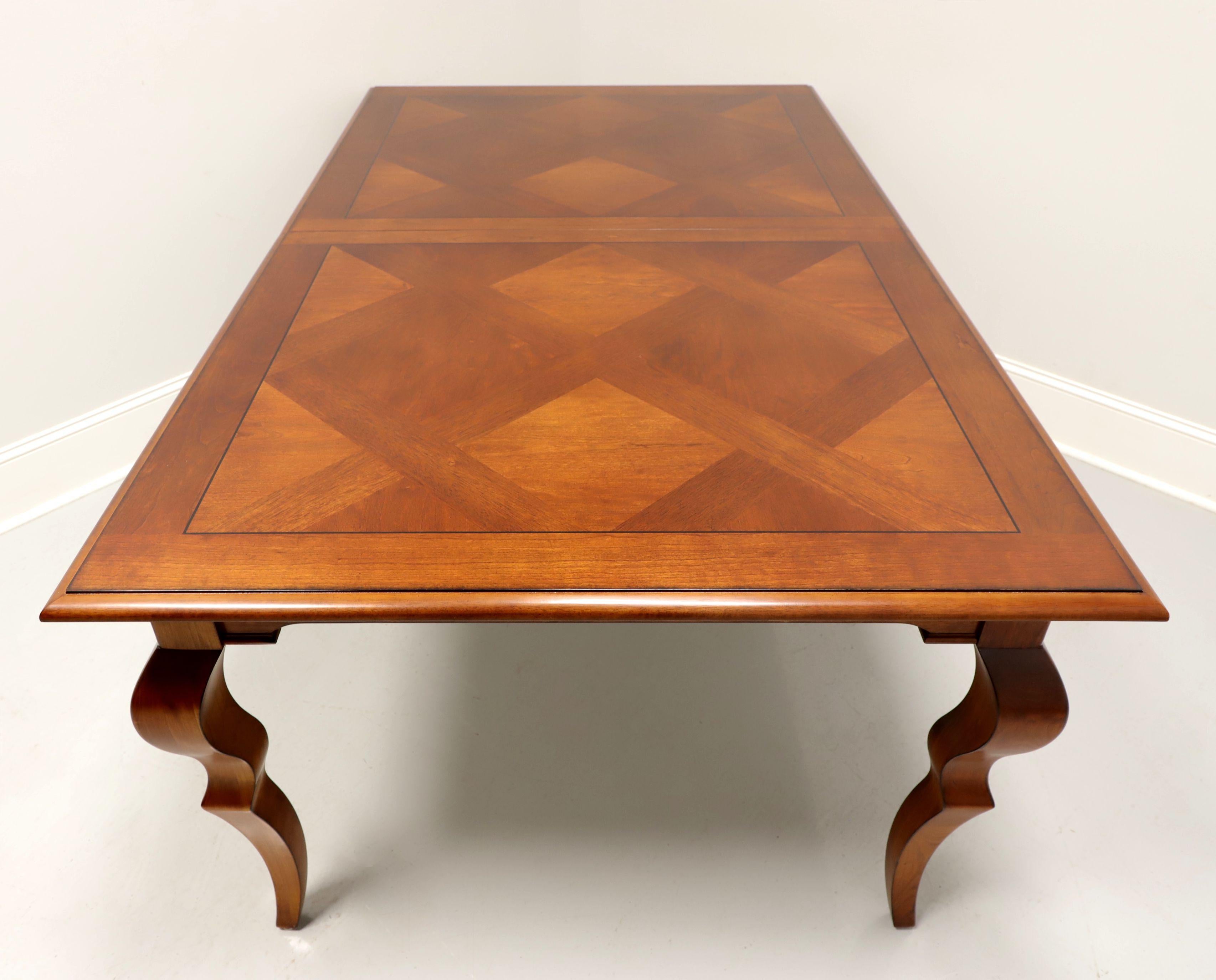 A French Country style rectangular dining table by Harden Furniture. Solid cherry with 