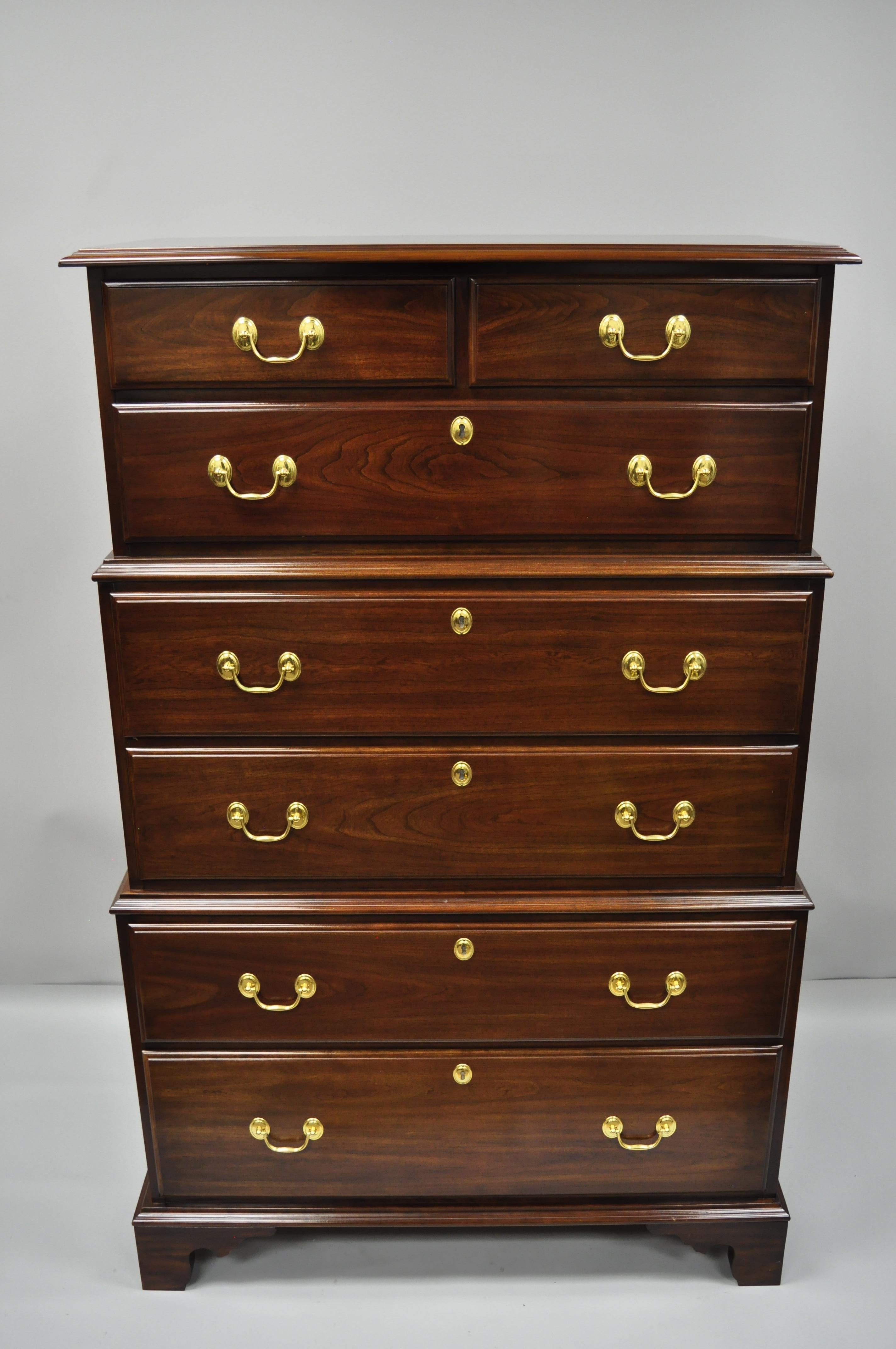 High quality Harden triple chest on chest cherry dresser with side handles. Item features solid wood construction, beautiful wood grain, original Harden stamp, seven dovetailed drawers, solid brass hardware, and quality American craftsmanship, circa