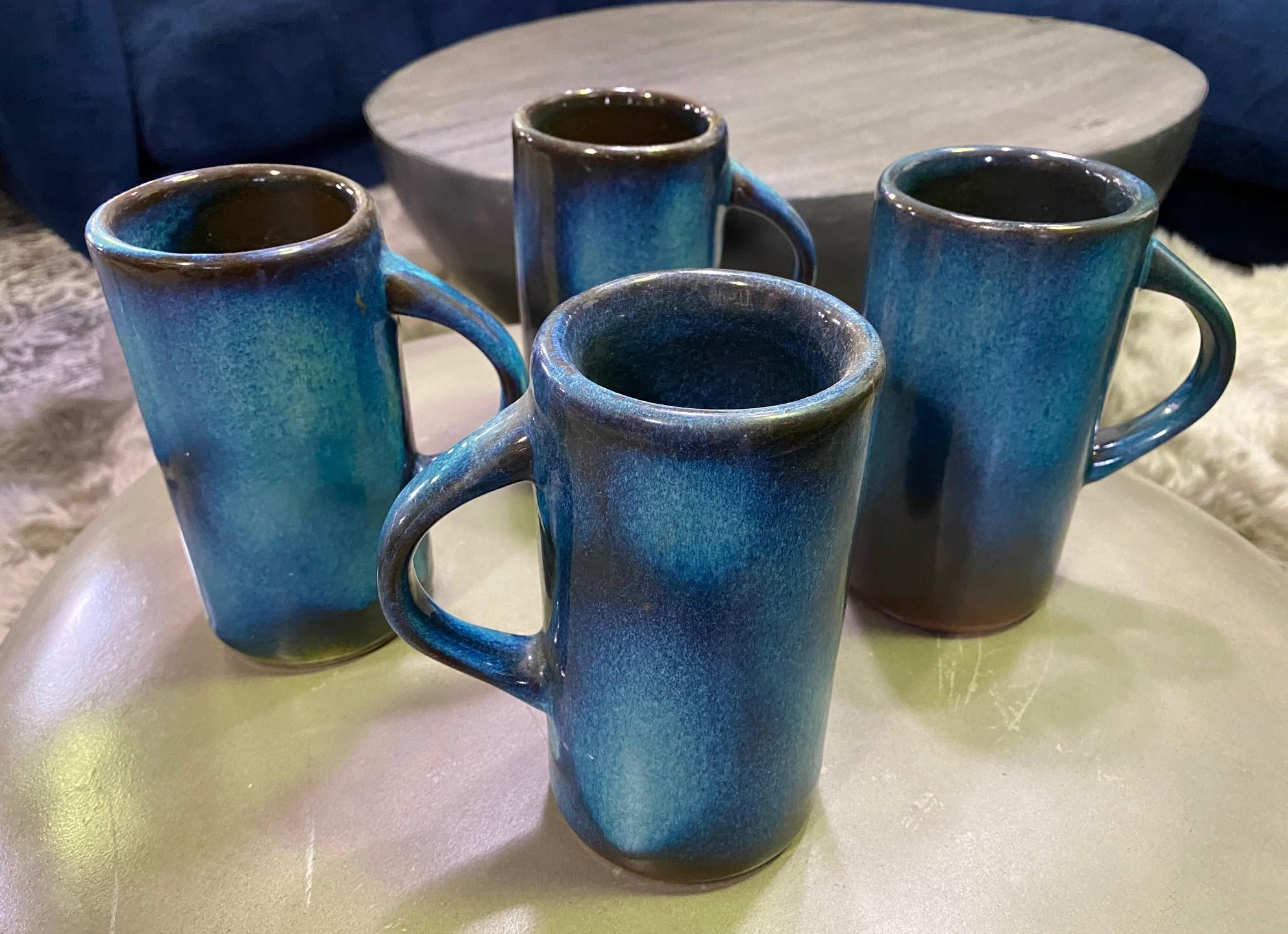 A group of hand-thrown, well-crafted, piercing blue glazed large, heavy tall mugs by famed Texas-born San Antonio ceramic master Harding Black. 

All pieces signed and dated (1970) by the artist on the base. 

These mugs/cups have a great feel