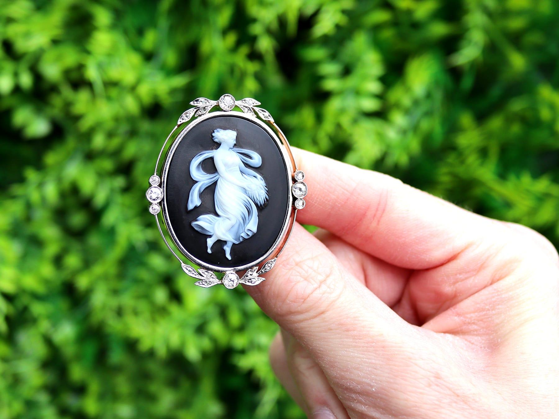 A stunning, fine and impressive antique hardstone and 0.78ct diamond, 18 karat yellow gold and silver set black cameo brooch; part of our diverse antique cameo jewelry and estate jewelry collections.

This stunning, fine and impressive antique