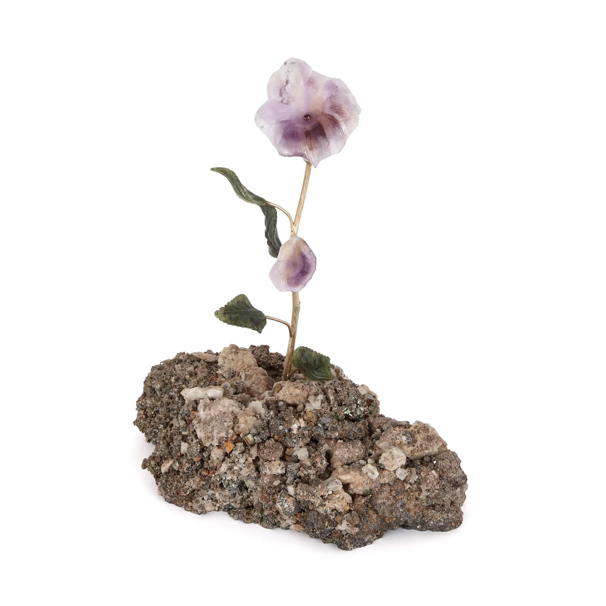 Hardstone, quartz, amethyst, nephrite and silver-gilt flower model
Continental, 20th century
Measures : Height 25cm, width 21cm, depth 12cm.

This exceptional decorative hardstone piece consists of a quartz base applied with an amethyst,