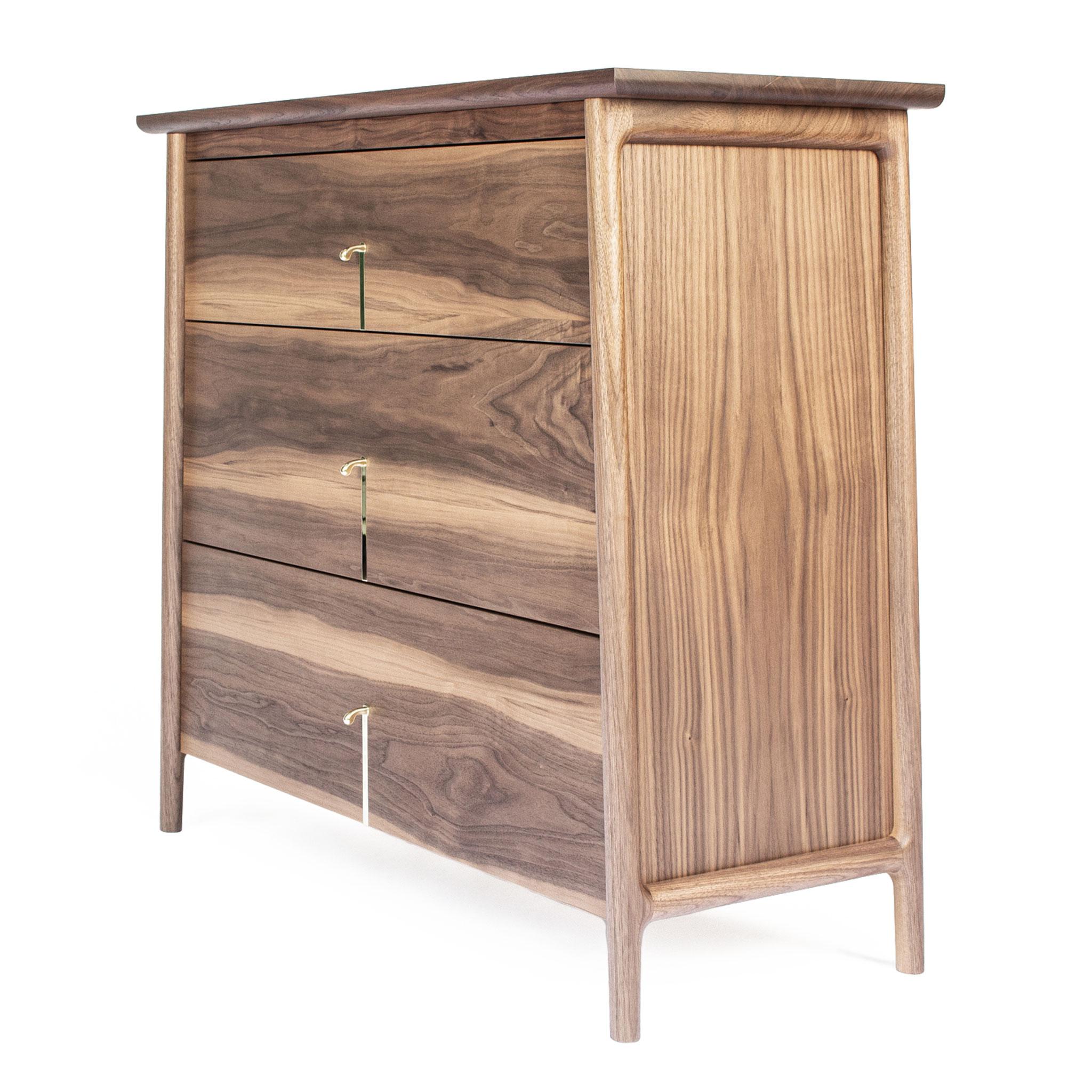 Hardwood dresser with custom drawer pulls. The custom brass pull is inspired by nature, the California Quail topknot. The tapering cabinet sides create a unique and beautiful visual line not often seen in cabinetry. Blumotion undermount soft close
