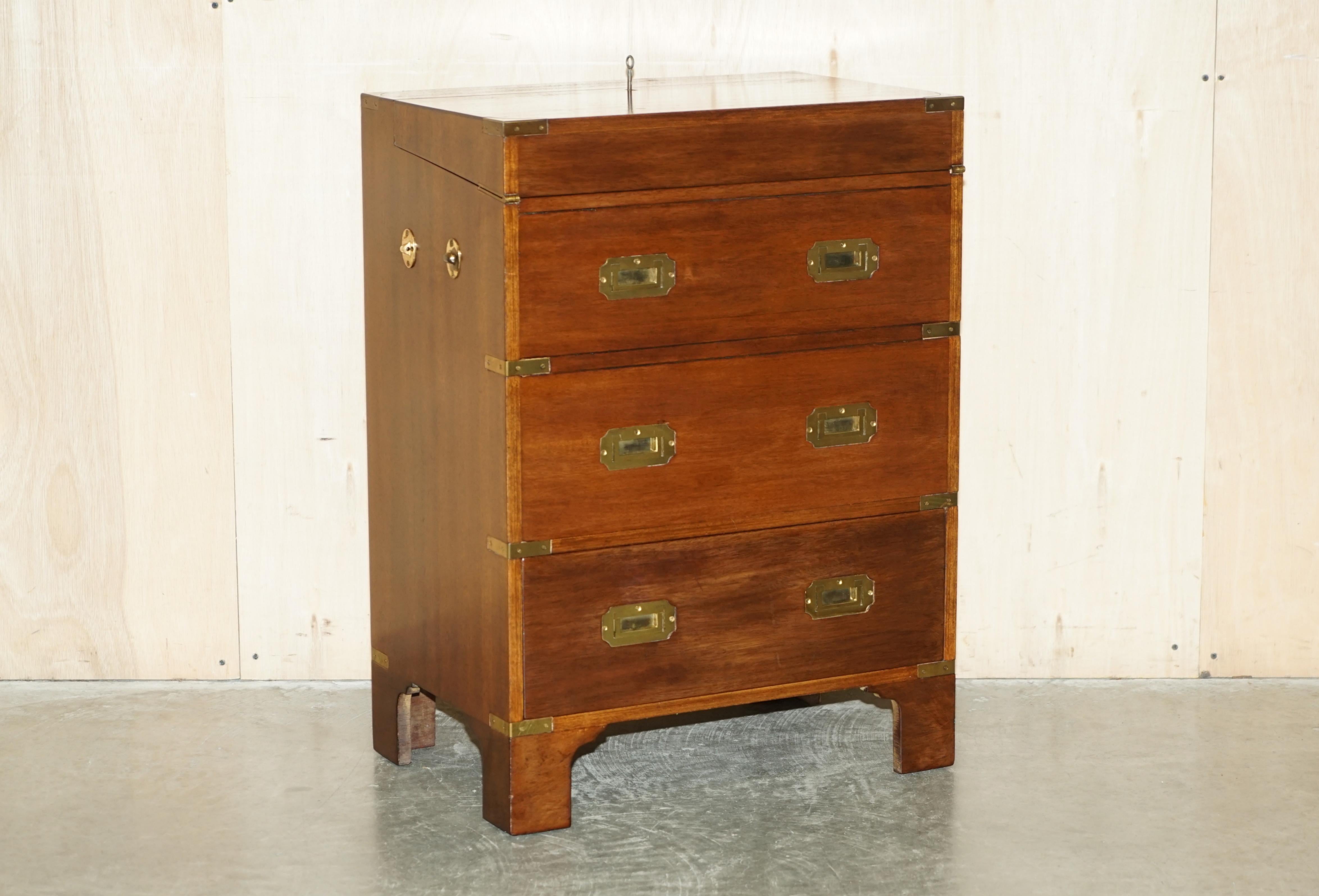 We are delighted to offer for sale this stunning circa 1920 Mahogany, Military Campaign side table sides drawers unit which houses a drinks cabinet

A very good looking well made and decorative piece, the drawers are faux apart from the bottom one