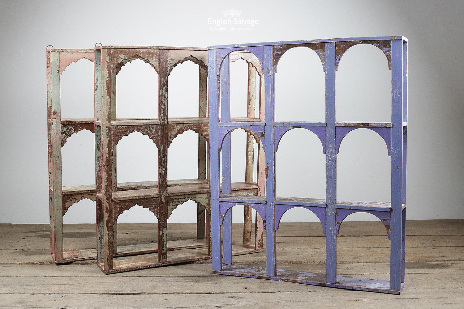 Hardwood arched display cases / shelving units with nine sections each. Can be wall-mounted (fixing rings present) or freestanding. Distressed paint and waxed finish. Measurements below +/- 1cm. Marks and chips throughout.