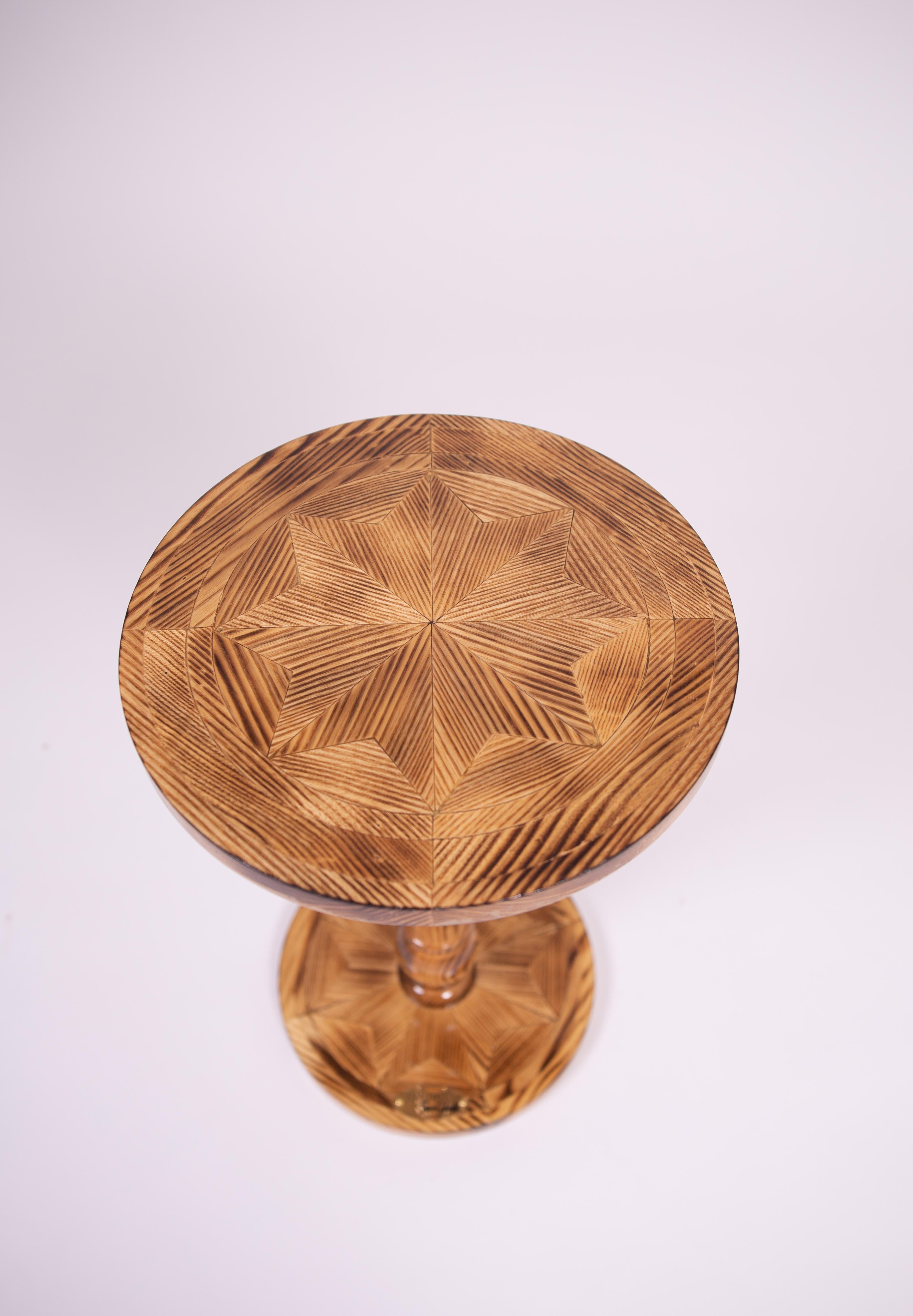 Handcrafted Solid Wood Side Table: This artisan solid wood side table features seasoned solid wood pieces arranged in a marquetry pattern, combined with the strength of butcher block construction to create a stunning, durable accent piece. Each