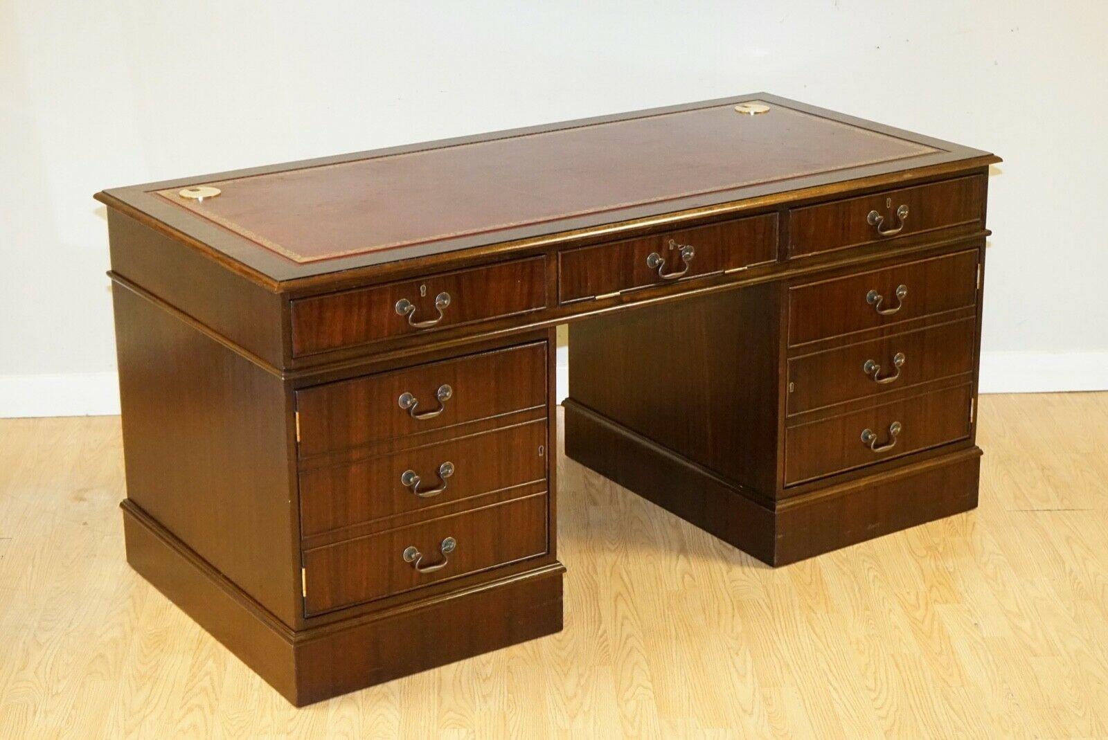 We are delighted to sell this Mahogany Pedestal Desk with Gold Embossed Burgundy Leather Top.

It has barely any noticeable wear all around, it must have been hardly used.

The desk has two brass grommets on the top back corners for cables and