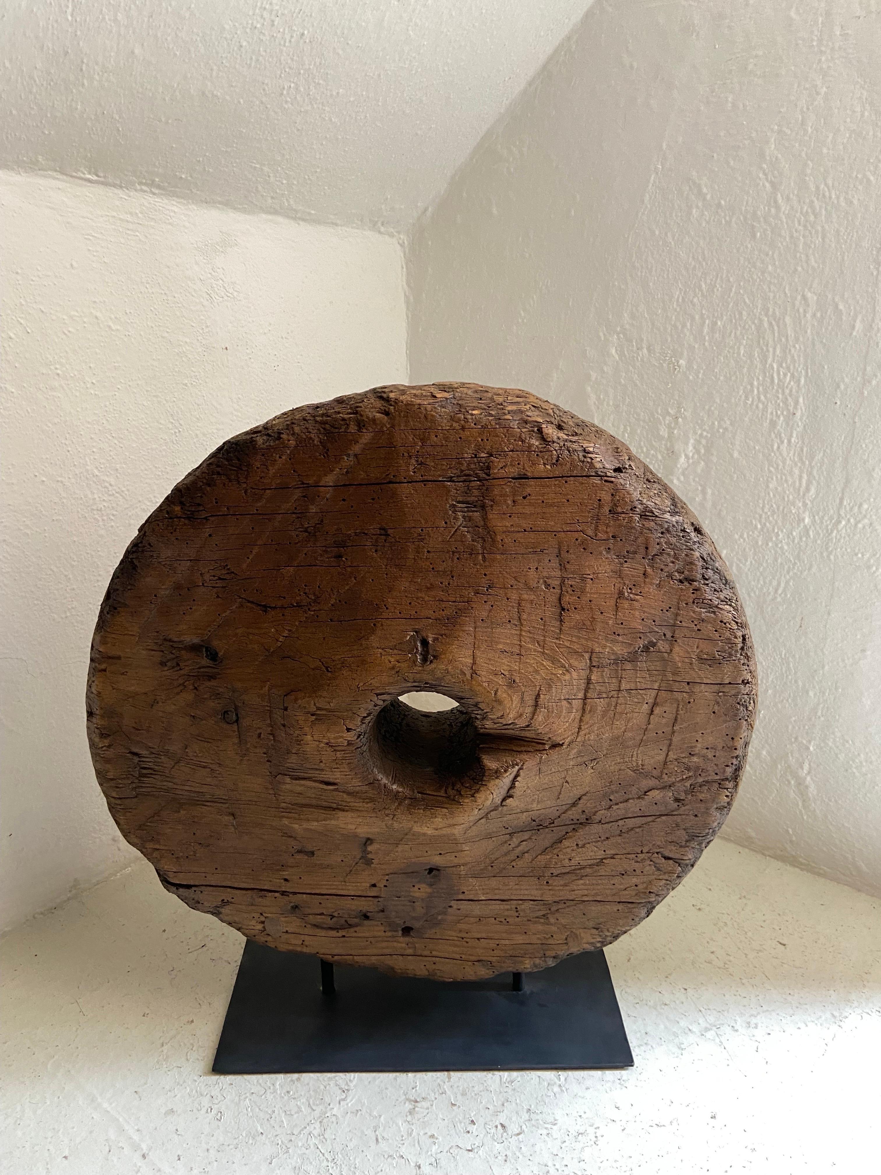 Hardwood wagon wheel from the state of Puebla, Mexico, circa early 19th century. The wagon wheel is from the colonial era. Most colonial wheels contain iron spokes, so it is quite rare to find wheels that are solid wood.