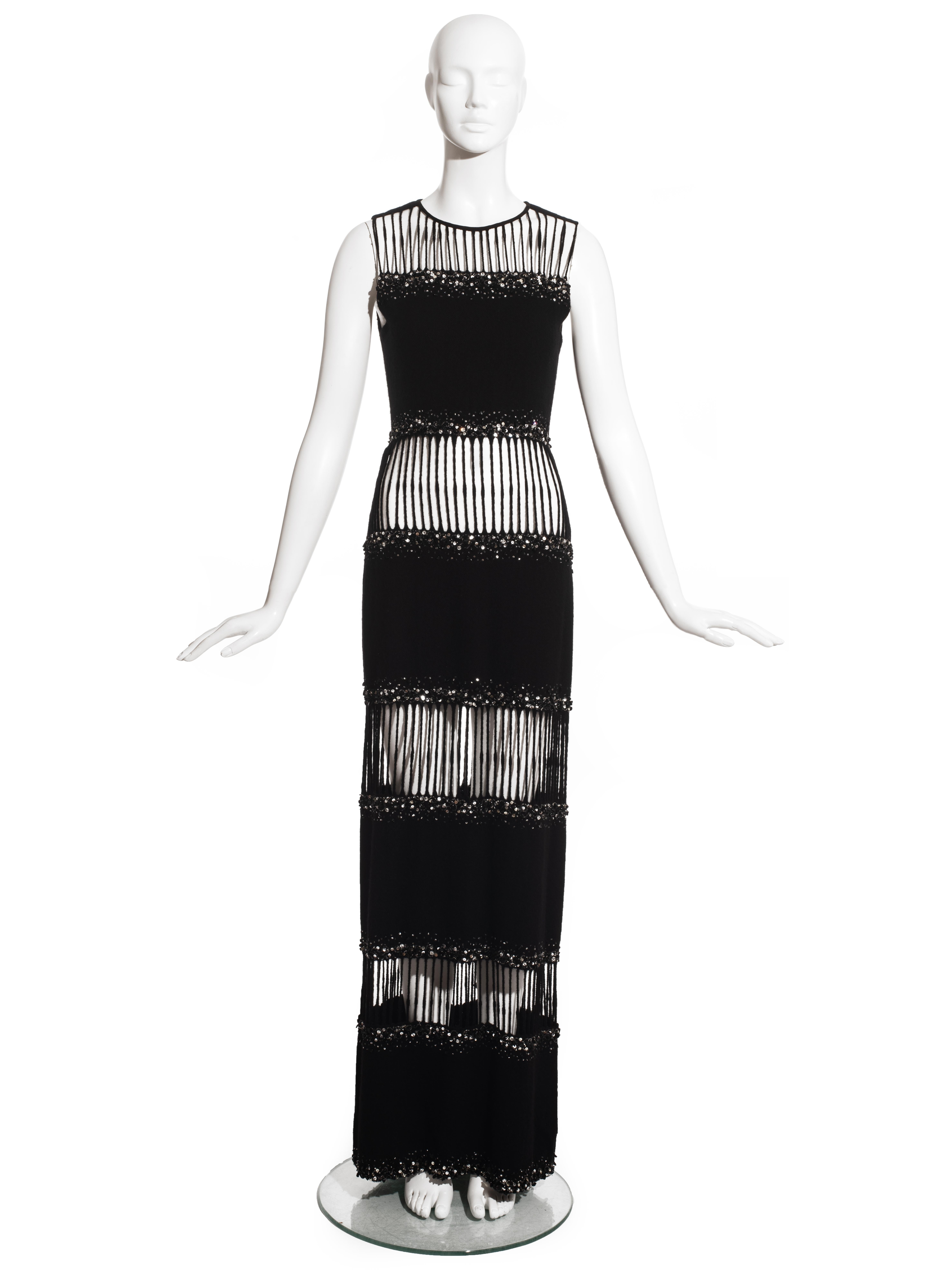 Hardy Amies couture black wool embellished evening dress constructed with four horizontal panels attached with thick wool thread. 

c. 1960
