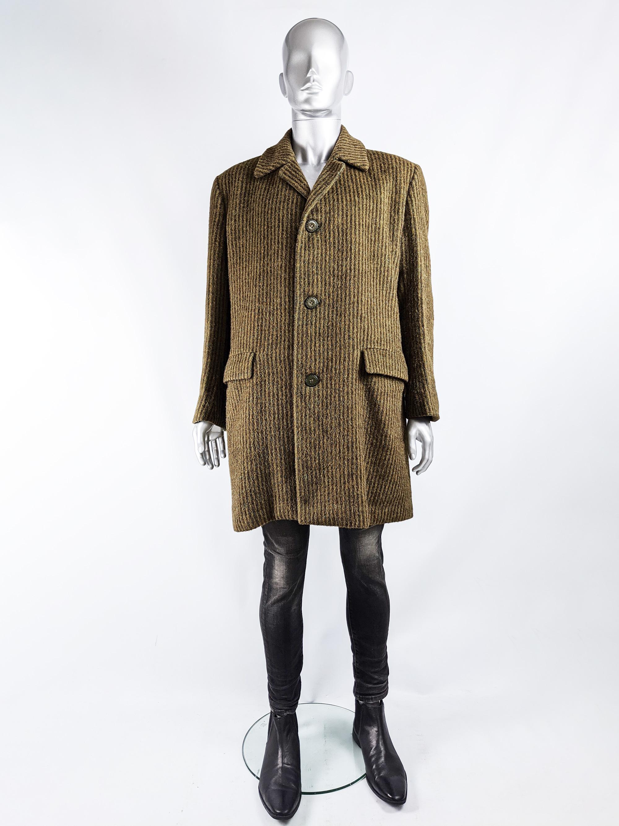 An excellent vintage mens overcoat from the 70s by iconic British fashion designer and Savile Row tailor, Hardy Amies for Hepworths. In a brown and green striped, fuzzy wool and cashmere with a green satin lining

Size: Marked GB 38