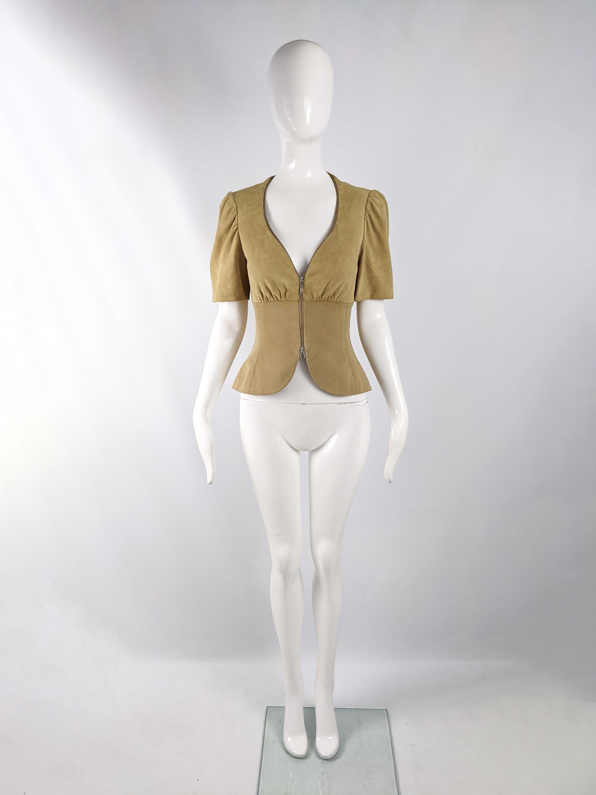 An impeccably tailored vintage womens jacket from the 80s by luxury British fashion designer and couturier, Hardy Amies. In a yellowish sandy suede fabric with a soft cotton tailored panel down from the bust. It has a metal, double zip feature and a