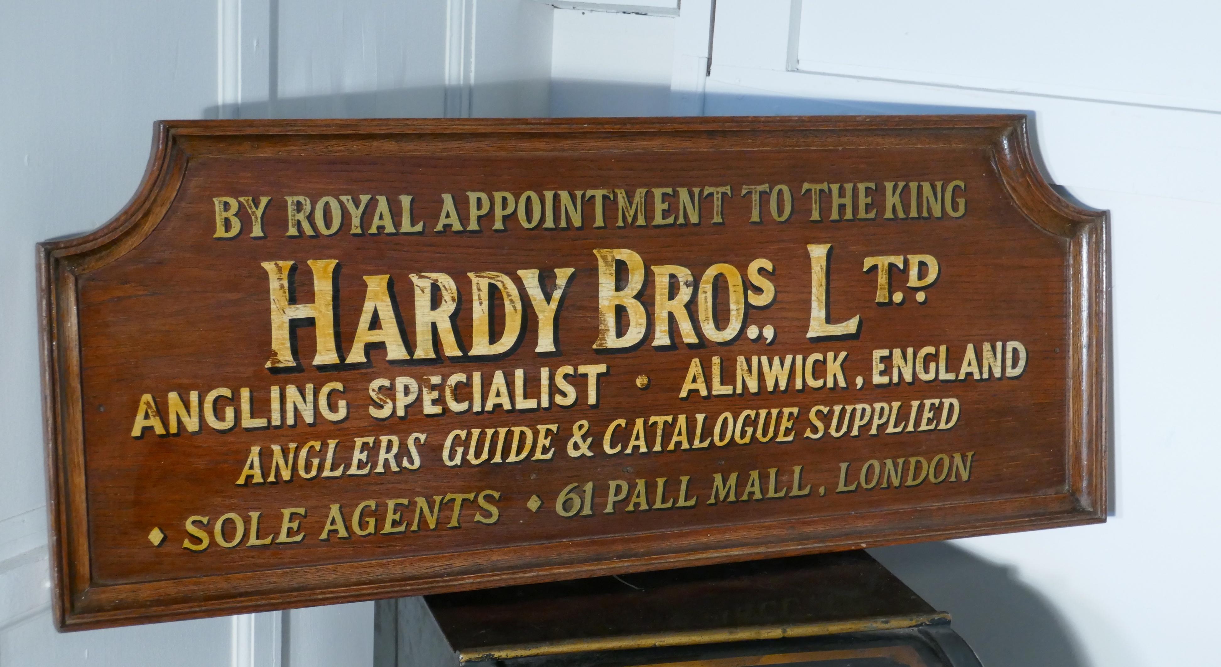 Hardy Bros Ltd, Angling Specialists large oak wall plaque 

This large wooden wall sign was painted for the London Shop which opened in 1907, it has the Royal appointment to HM the King at the top
The plaque has gold writing on an oak board with