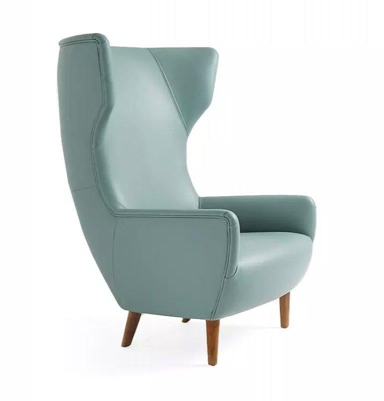 Hardy wingback chair by Dare Studio, 2011
Dimensions: H 125 x D 85 x W 76 cm
Materials: American black walnut legs, muirhead jade leather

Also available in European white oak, natural oak or black stained oak.
All pieces are available in a
