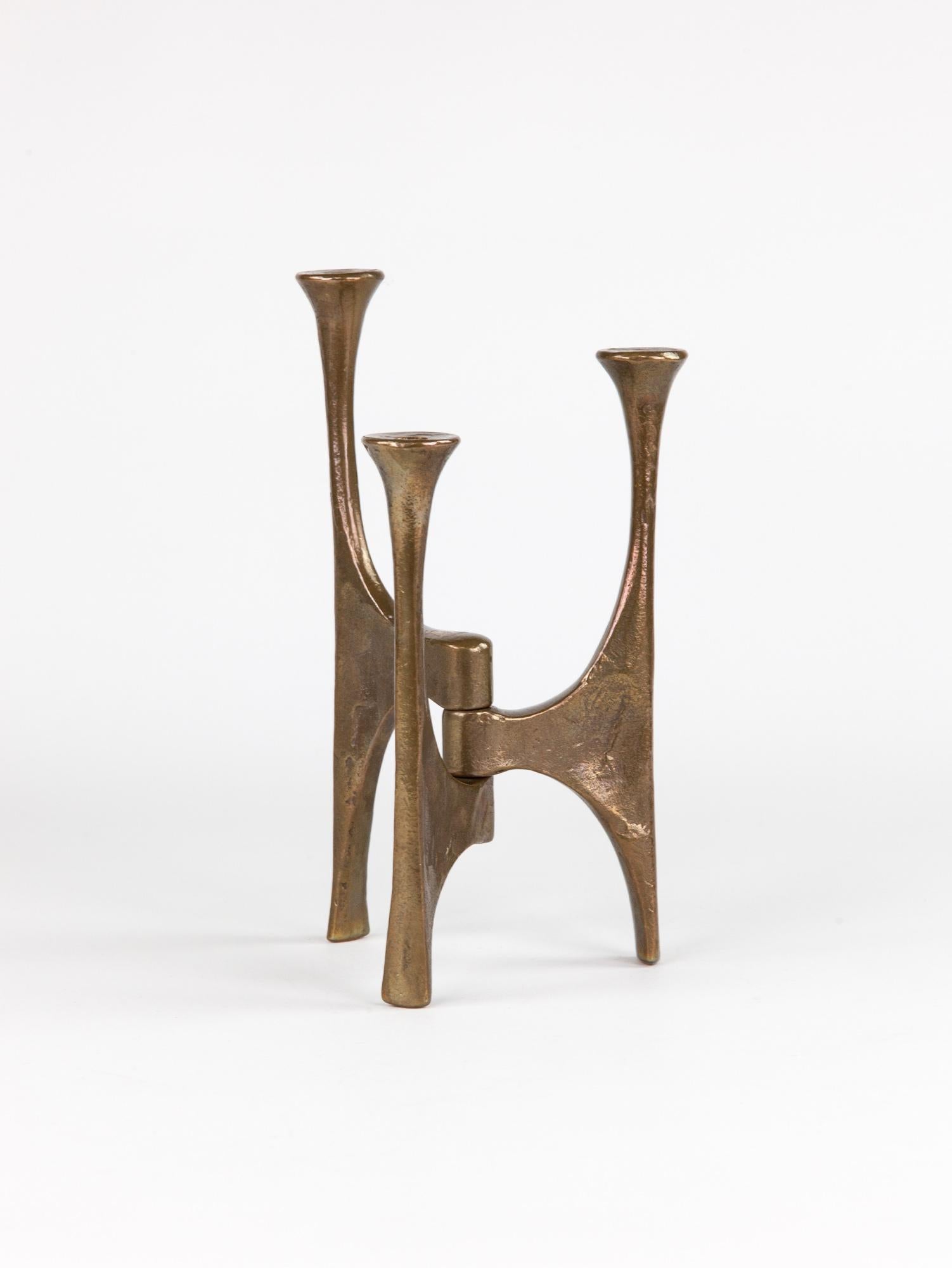 

A stunning brutalist bronze candle holder by Michael Harjes. The handmade sculptural candle holder has a beautiful textural surface. Large in size the candle holder holds three candles or can be used ornamentally as it is simply beautiful on its