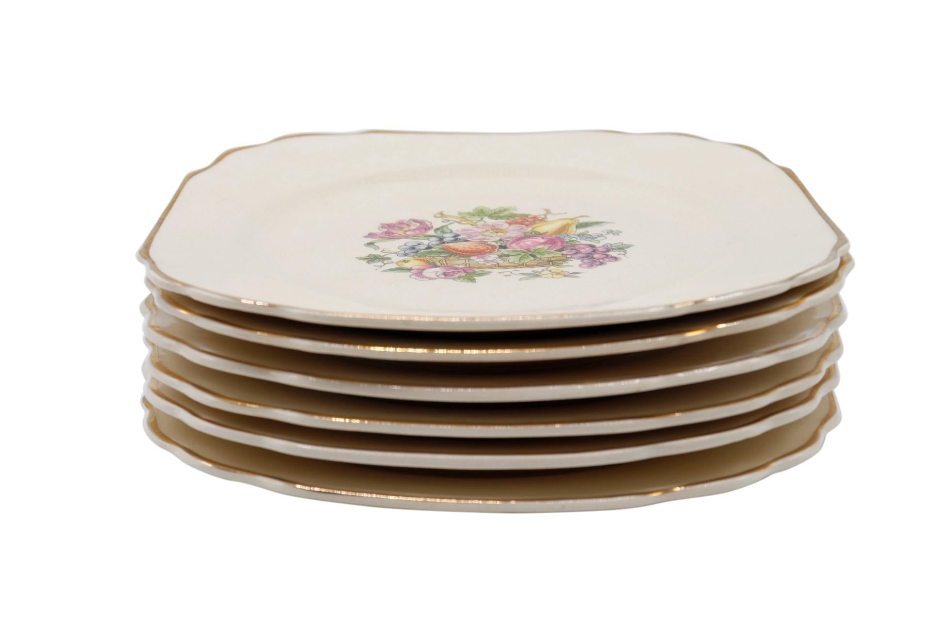 A set of six dessert or bread and butter plates made by Harker for Bakerite. Square plates are decorated in the 