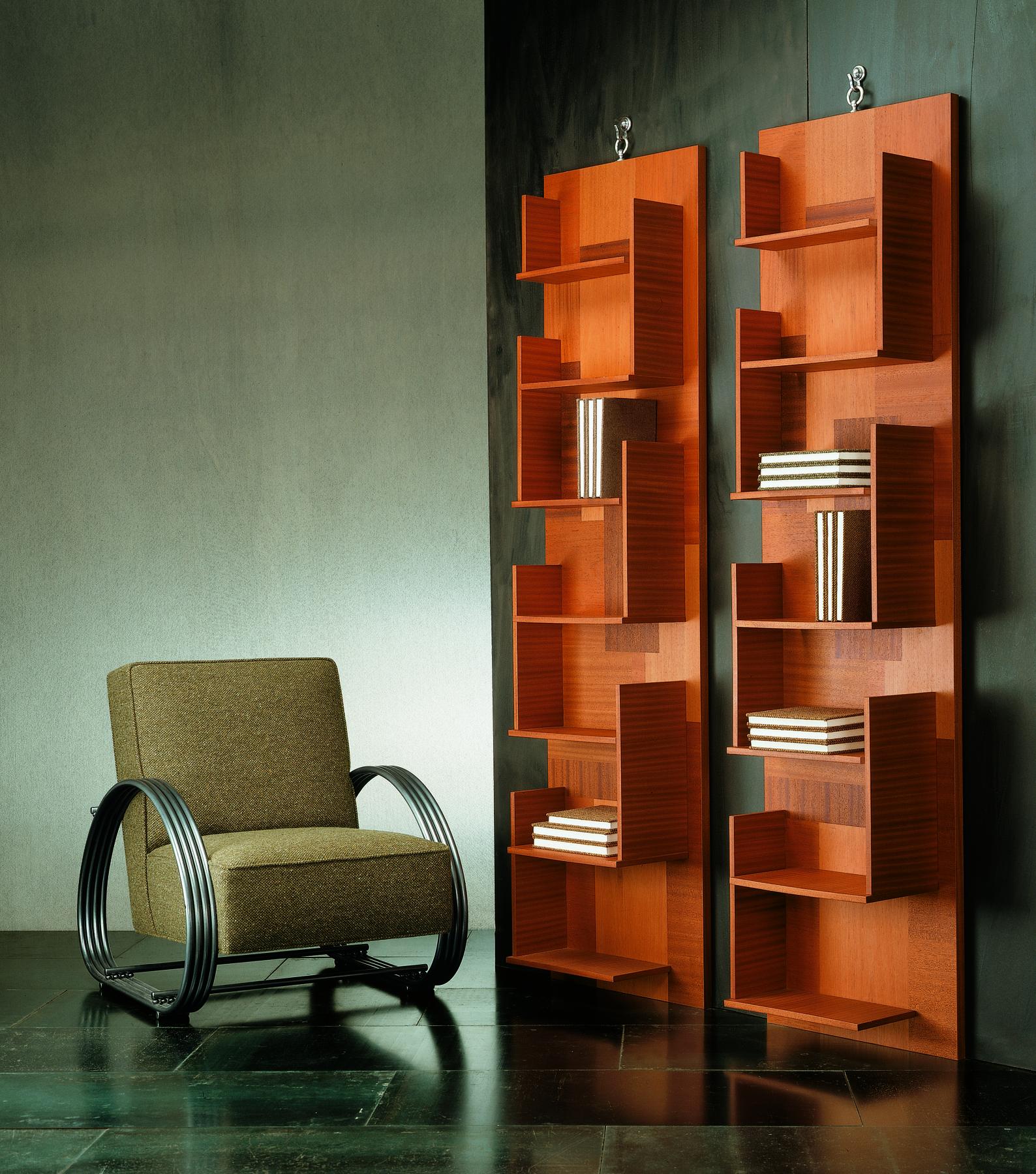 This wall-mounted bookcase seamlessly blends functionality with aesthetic appeal. The inlaid back and shelves, meticulously crafted from various mahogany species, create a tapestry of rich tones and textures, turning each shelf into a work of