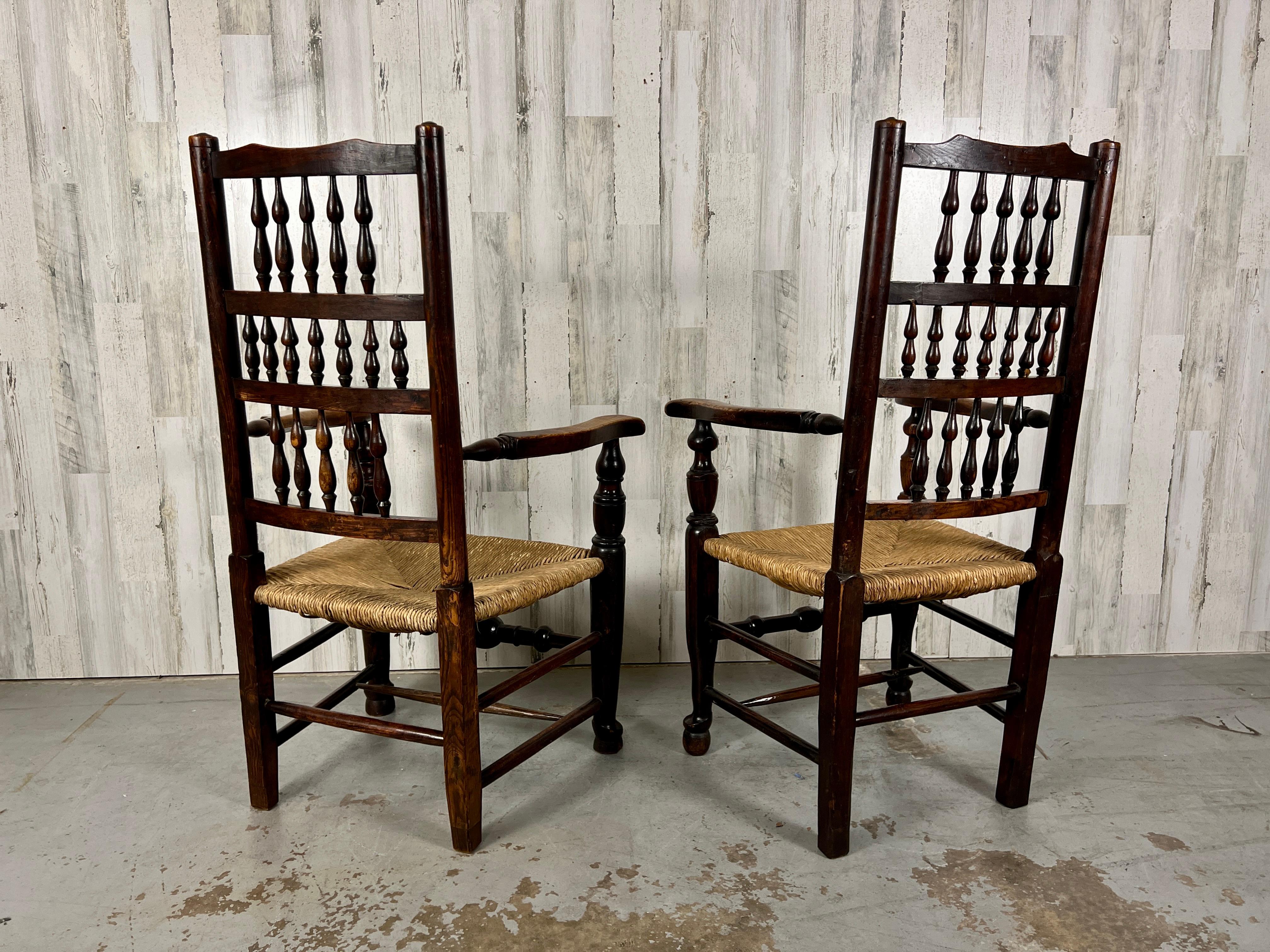 Georgian antique harlequin spindle back dining chairs with woven rush seats. Classic old English design where each chair is a little different. Please see pictures.

 Armchair, 21 deep by 25 1/2 wide by 43 1/4 tall by seat height, 16 inches arm