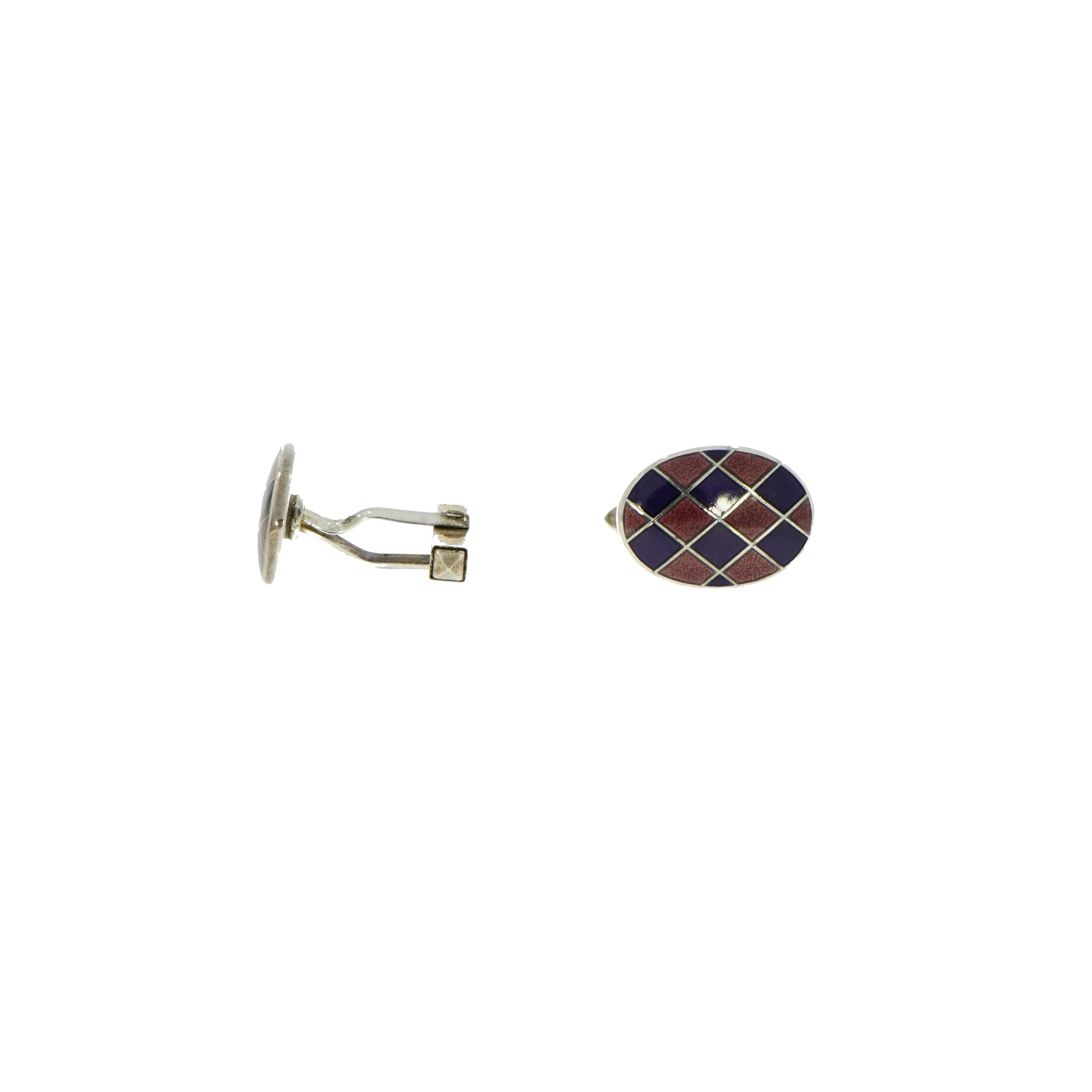 Worn with a white shirt, vintage tie and jeans or a classic suit this pair of cufflinks will certainly make an individual style statement. This sterling silver harlequin enameled oval cufflinks is handcrafted in England and measures 14mm x 19mm.