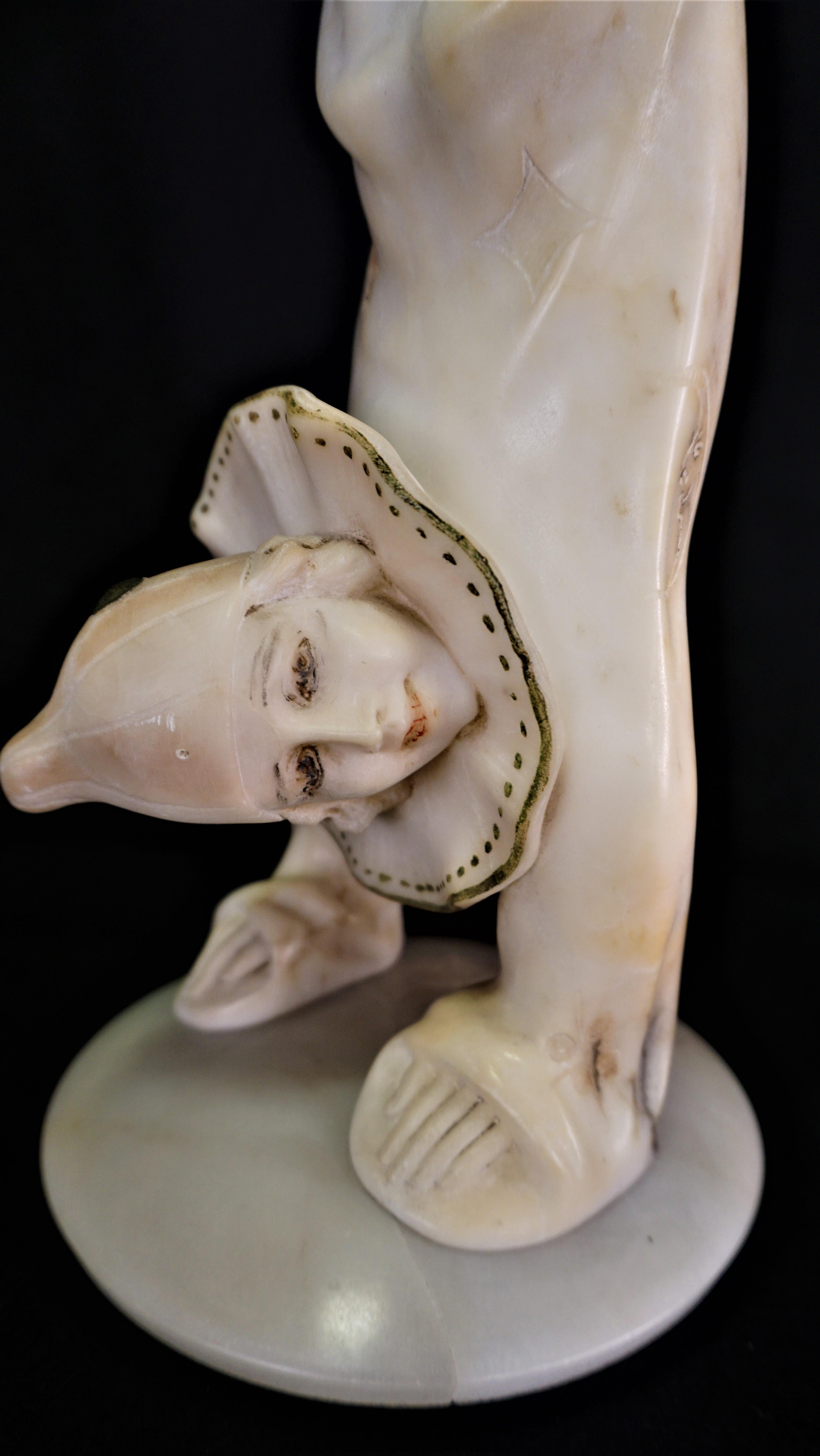 Art Deco alabaster harlequin in acrobatic position from 1930s signed sculpture.