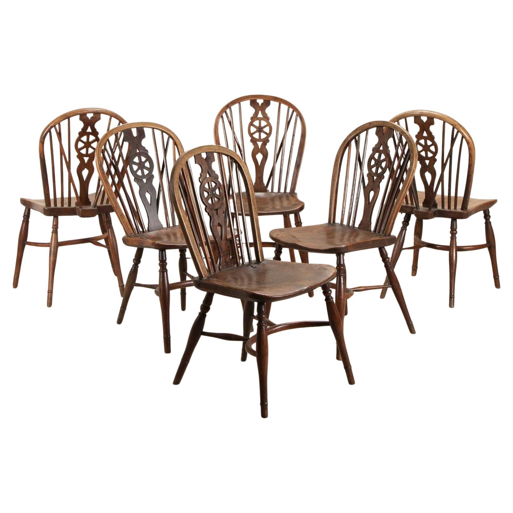 Harlequin Set of Six 19th Century Wheel Back Chairs