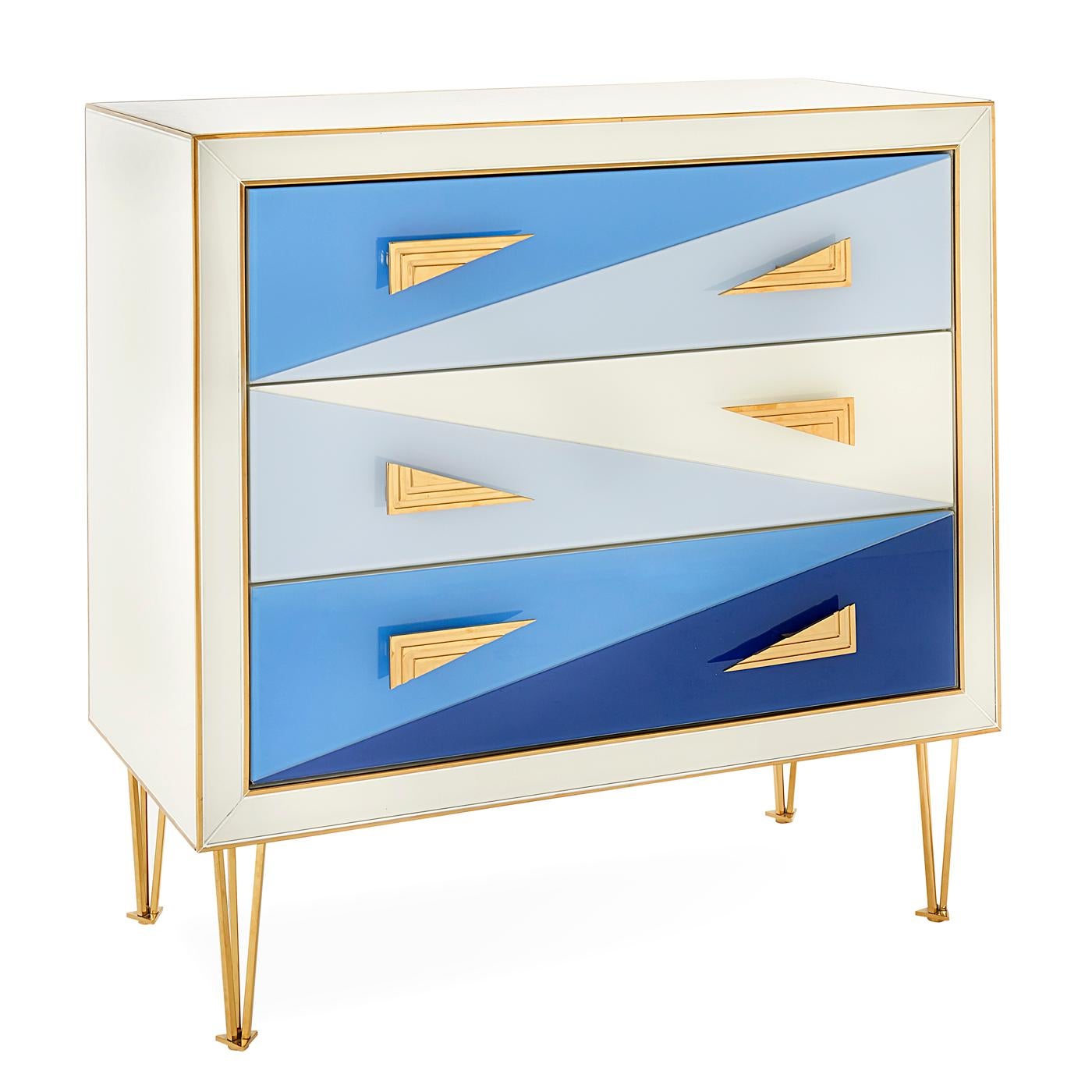 Avant Wow. A little Italian Modern, a lot of irresistible color. Our Harlequin Three-Drawer Chest features back-painted glass panes in angular forms and bold, brilliant blues. The ivory case is tipped with brass edging, adorned with super-modern