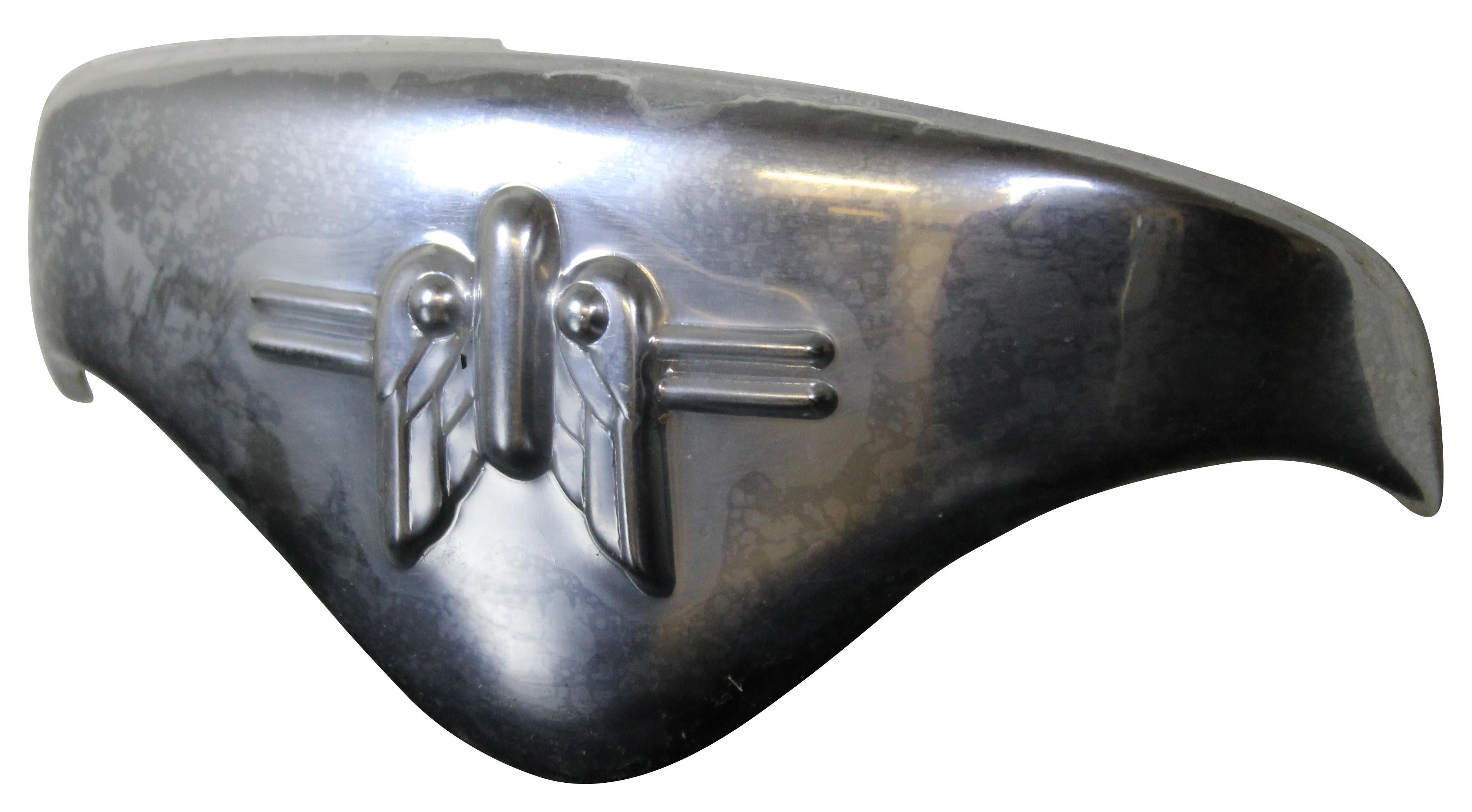 Vintage Harley Davidson Knucklehead Panhead chrome front fender tip with winged rocket design.

Originally purchased in the 1980s from the Pennsylvania warehouse where a cache of new old stock Harley parts were discovered.