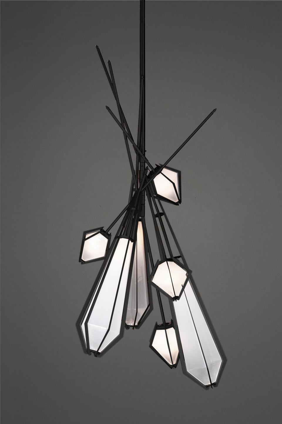 Harlow Dried flowers is an elegant sculptural light fixture inspired by jewelry design featuring a mold-blown glass gem in a chic metallic setting to create an asymmetrical starburst of light. Harlow is available in various color ways, and held in a