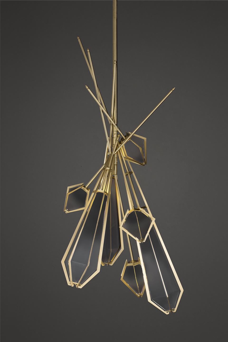 Harlow dried flowers is an elegant sculptural light fixture inspired by jewelry design featuring a mold-blown glass gem in a chic metallic setting to create an asymmetrical starburst of light. Harlow is available in various color ways, and held in a