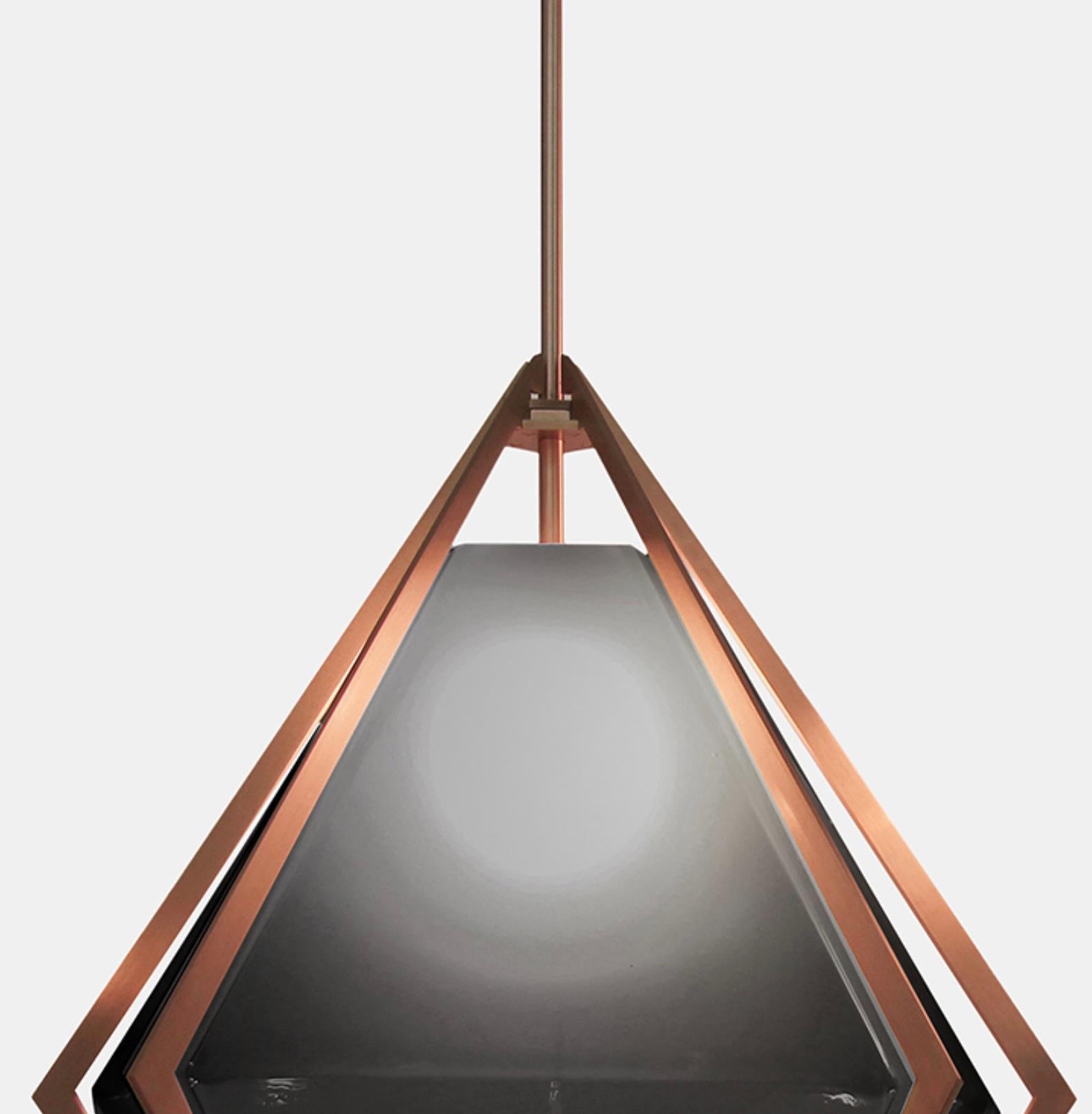 The Harlow Large Pendant offers an elegant starburst of light that reflects and refracts through its mold-blown glass shade. A sparkling prism, the Harlow Large Pendant is directly inspired by the world of jewelry with its metallic frame encasing a
