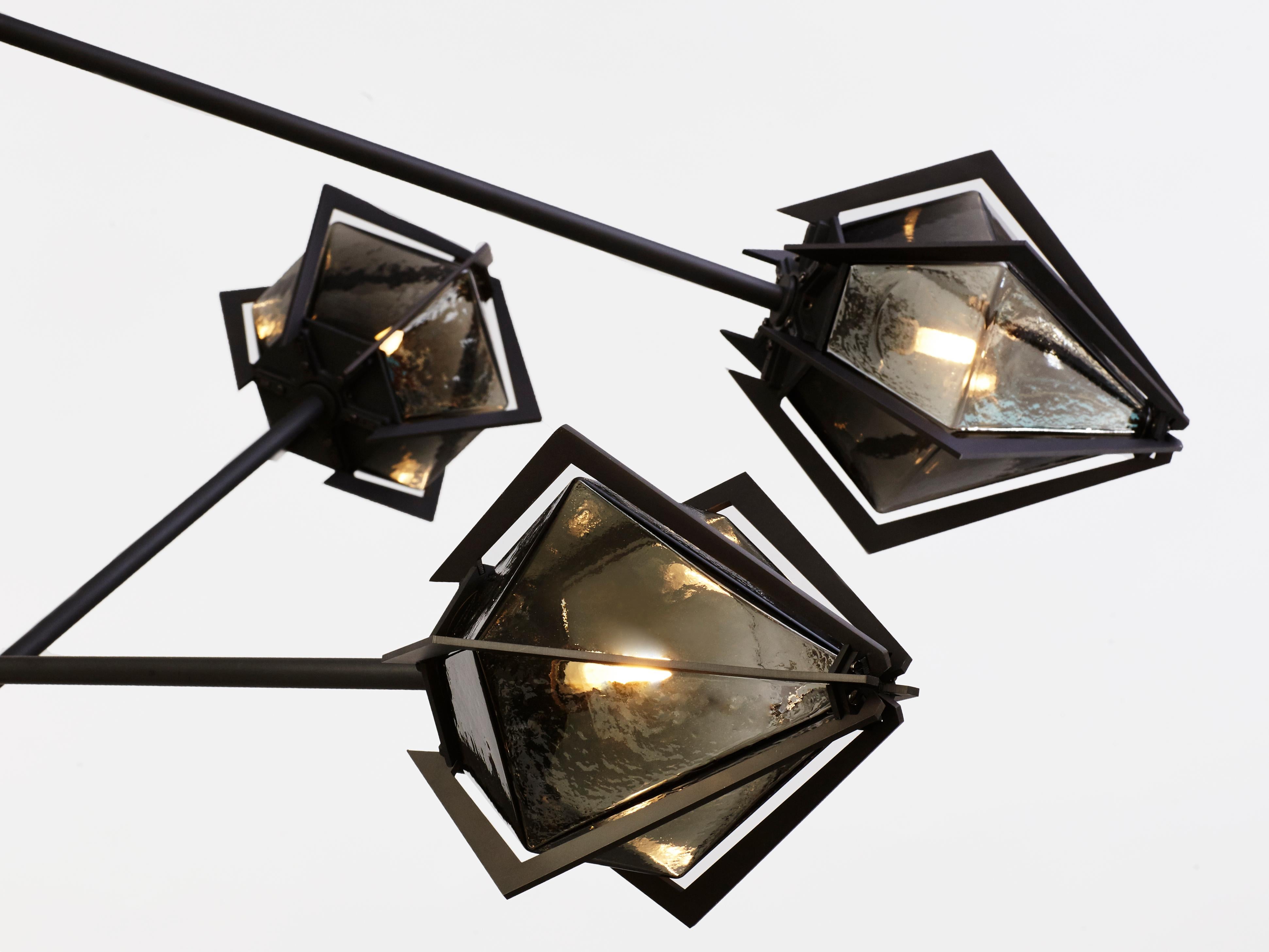 Elegant sculptural light-fixture inspired by jewelry design featuring a mold-blown glass gem in a chic metallic setting to create an asymmetrical starburst of light.

Harlow is available in various color ways, and held in a metallic frame