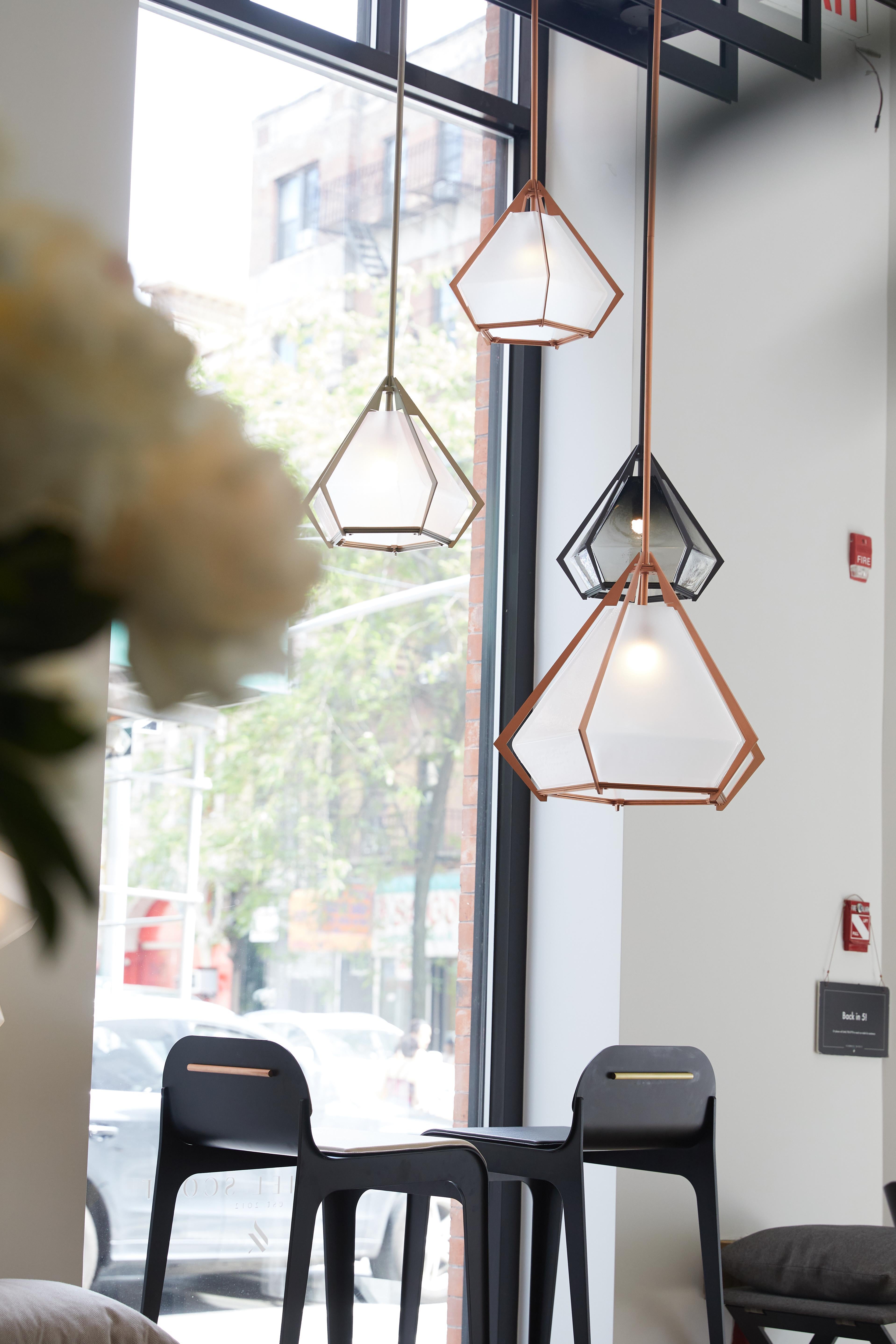 The Harlow Small Pendant offers an elegant starburst of light that reflects and refracts through its mold-blown glass shade. A sparkling prism, the Harlow Small Pendant is directly inspired by the world of jewelry with its metallic frame encasing a