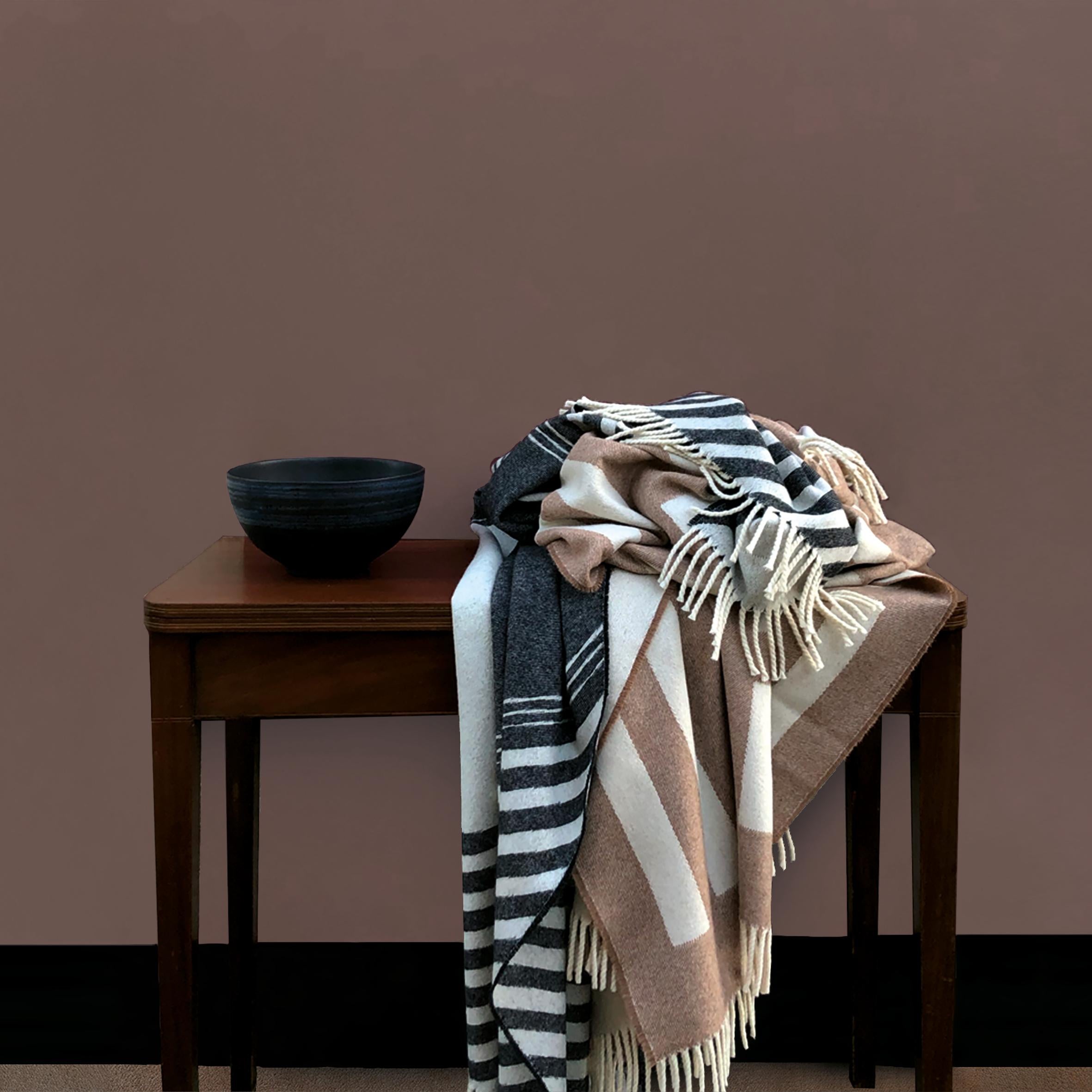 Our Harmon throw is inspired by architectural references. Its woven design adds a bold pop of pattern whether laid across a sofa or a bed.

Designed to have a meaningful impact on everyday home life, our throws are the ultimate balance between