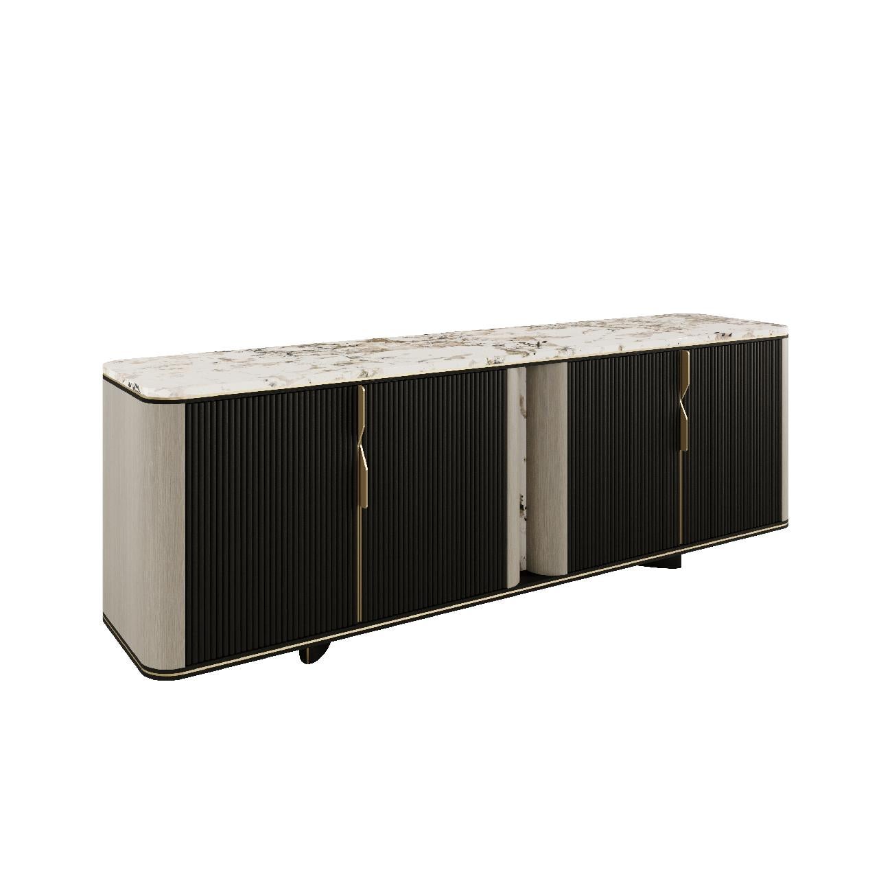 Harmony sideboard is the perfect balance between form and function. 

With its gently curved corners, natural stone top, fluted door fronts and contrasting shades of solid wood and veneer, it conveys a sense of serenity and elegance. A harmonious