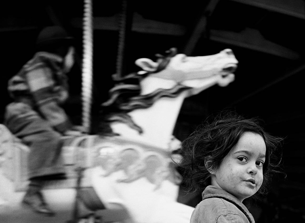 Harold Feinstein Portrait Photograph - Gypsy Girl at the Carousel, Coney Island