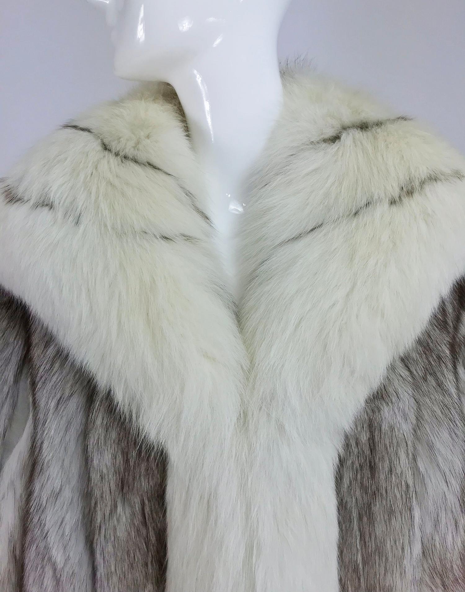 Harold J Rubin Original, Silver and cream fox fur jacket From the 1980s. This stylish jacket is soft and full the fur in a light silver, the deep collar and facings in an off white with silver lines. The fur is set in vertical band each separated