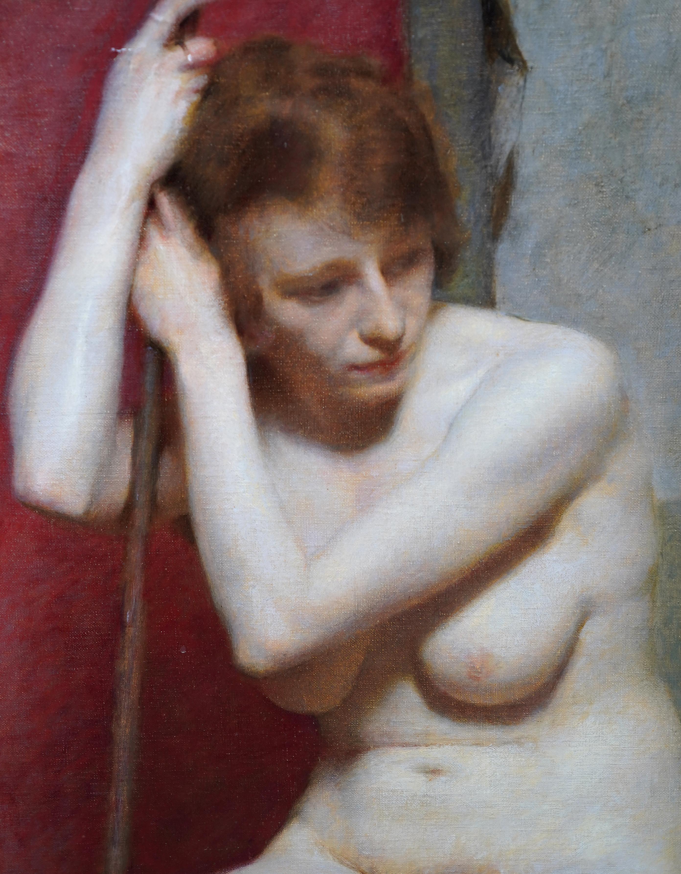 This superb British nude portrait oil painting is attributed to the circle of Harold Knight. Painted circa 1930, it is a seated study of a nude woman in soft focus, arms raised to one side to hold a staff and gazing down to her left. The background
