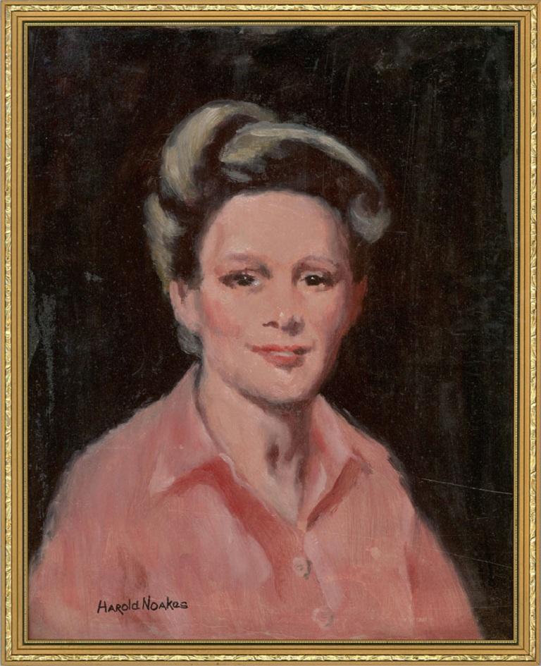A portrait of a smiling woman in a pink shirt. Presented in a gilt-effect wooden frame. Signed to the lower-left edge. Label to the verso which includes the name of the sitter. On board.
