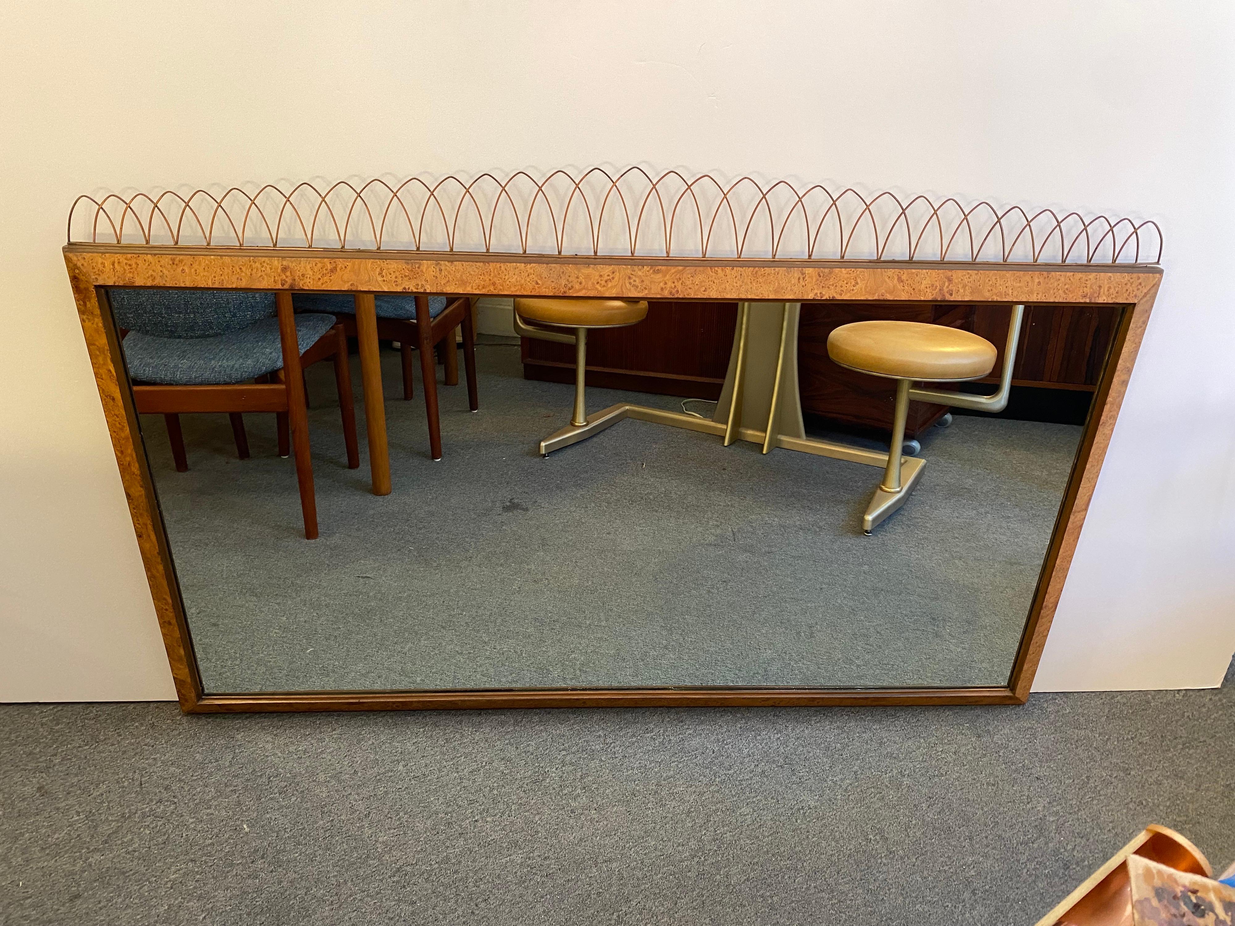 Burled walnut framed mirror with metal crown detail on the top. Beautiful mirror to place above a modern credenza or dresser.