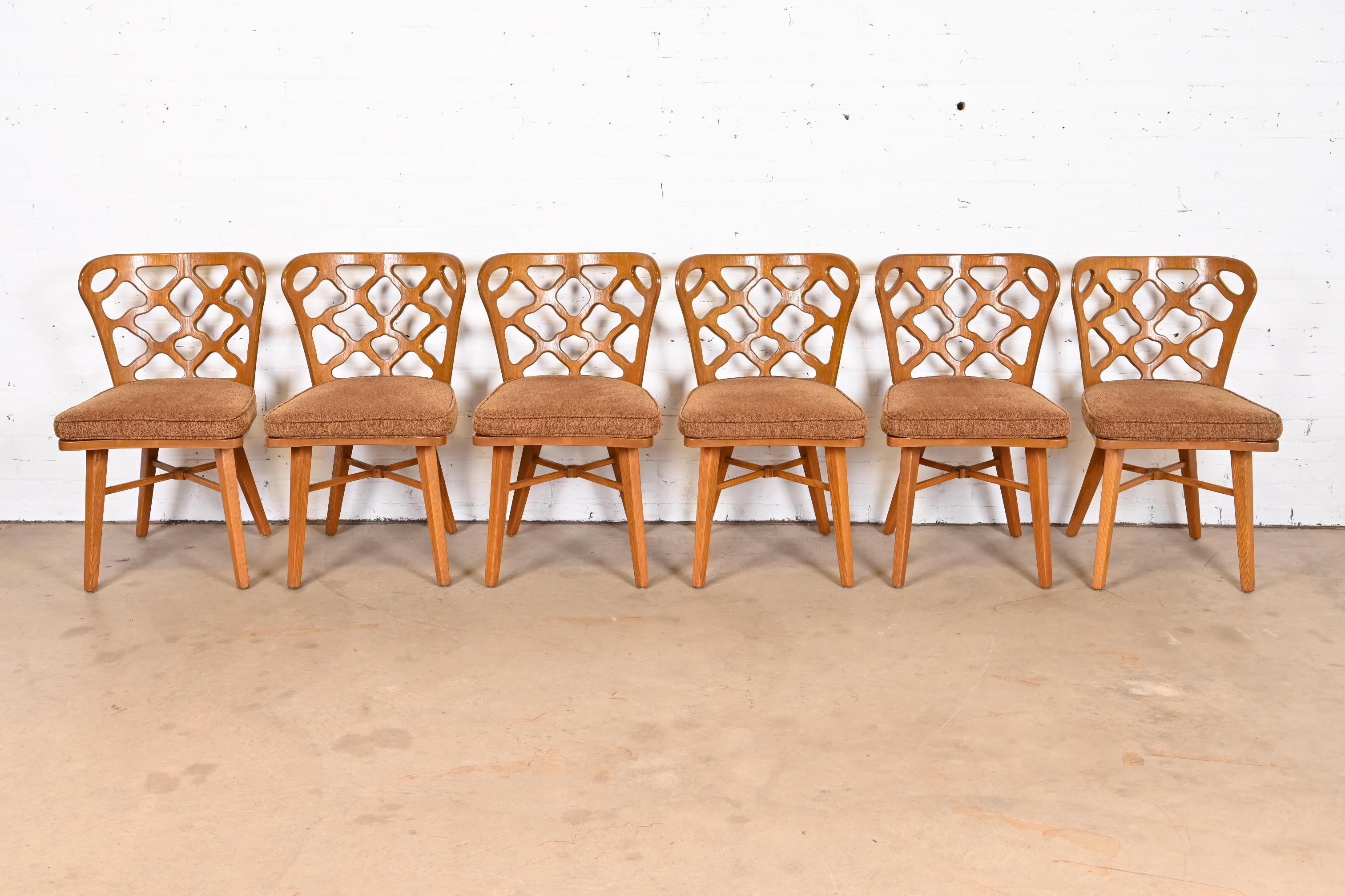 An exceptional set of six Mid-Century Modern sculptural dining chairs

By Harold Schwartz for Romweber

USA, 1950s

Sculpted oak, with upholstered seats.

Measures: 19.75