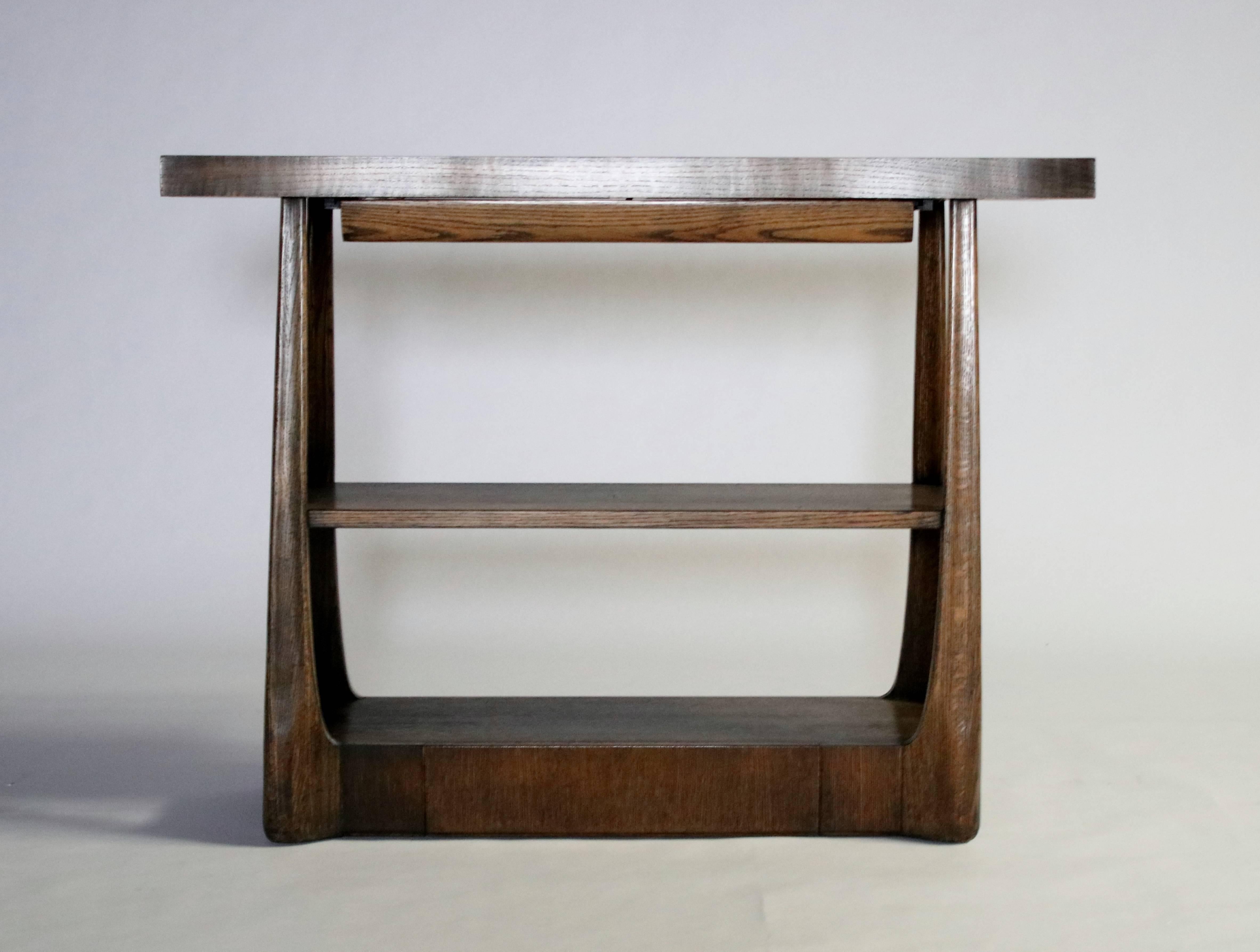 Harold Schwartz server model #M-749 for Romweber Originals in Modern series, 1955 in a walnut stained oak. Top, when extended, reveals a sunken copper tray. Two pull-out drawers including a utensil drawer under the top and a bottom drawer concealed